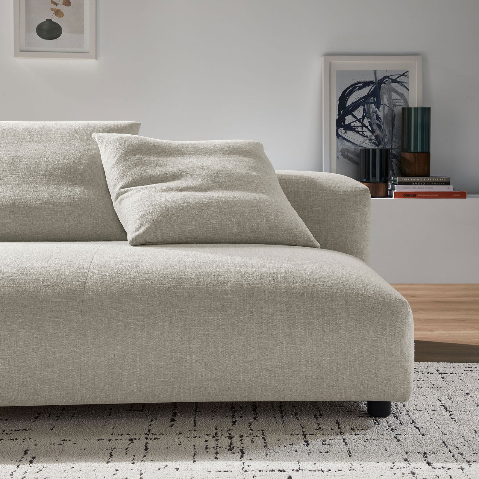 Cozy linen loveseat pairs effortlessly with layered decor to create a relaxed, contemporary lounge corner || EEI-6891-LIN || front_angle_room