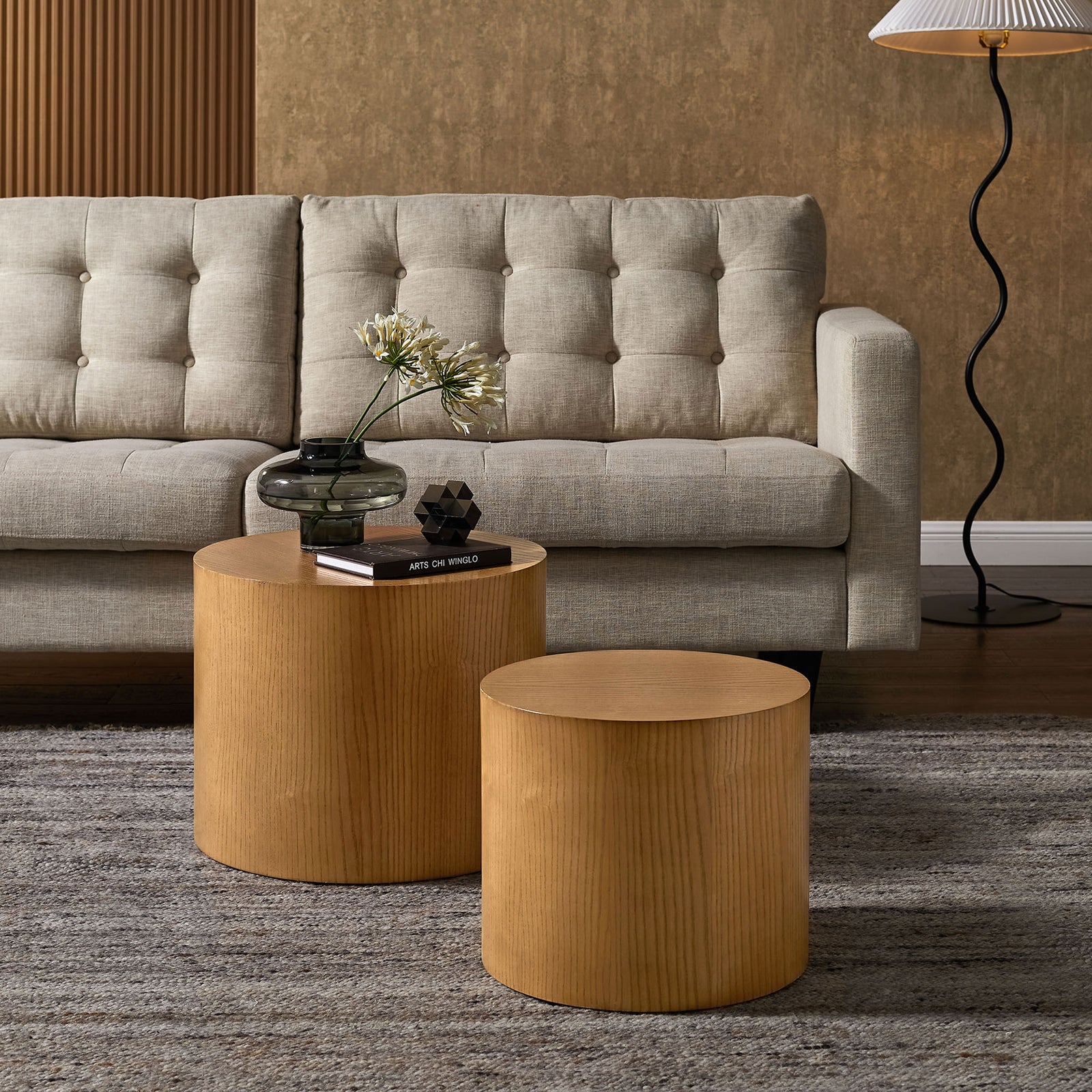 Pair of natural round coffee tables elevate the living room with clean, minimalist drum silhouettes || EEI-6893-NAT || front_angle_room