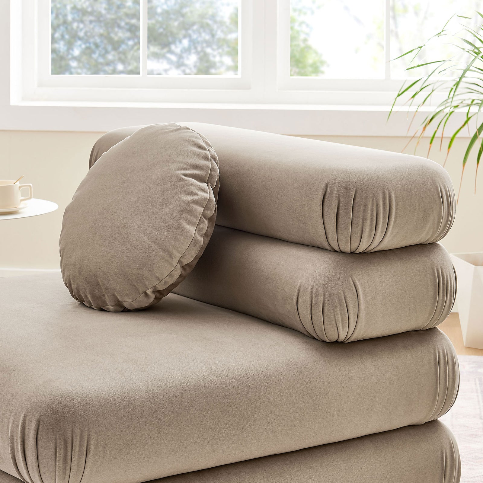 Soft-touch velvet and cushy layered design invite lounging, styled with a round accent pillow. || EEI-6896-TAU || detail_room