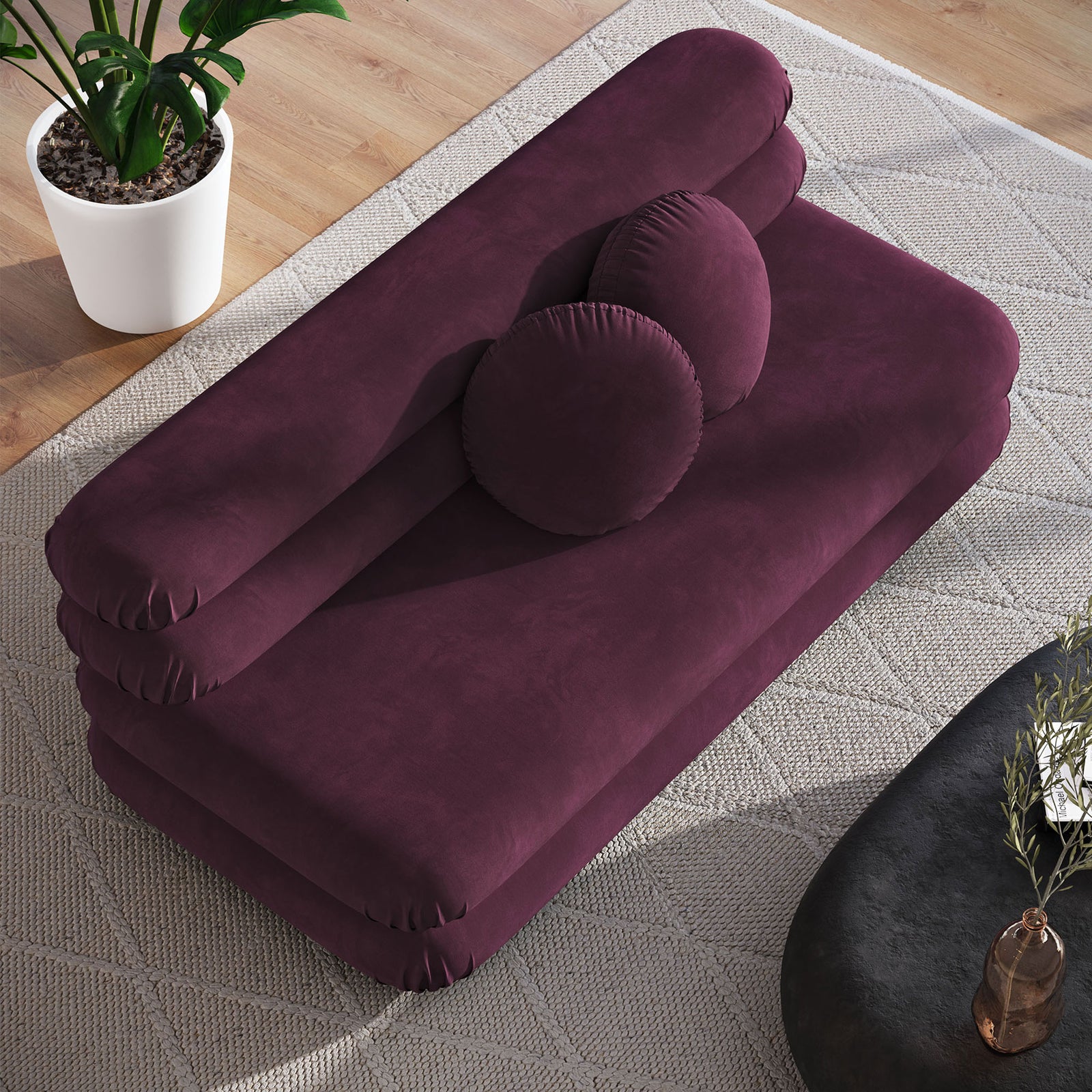Mulberry velvet loveseat showing expansive lounging surface and round pillows within cozy living room || EEI-6897-MUL || top_angle_room