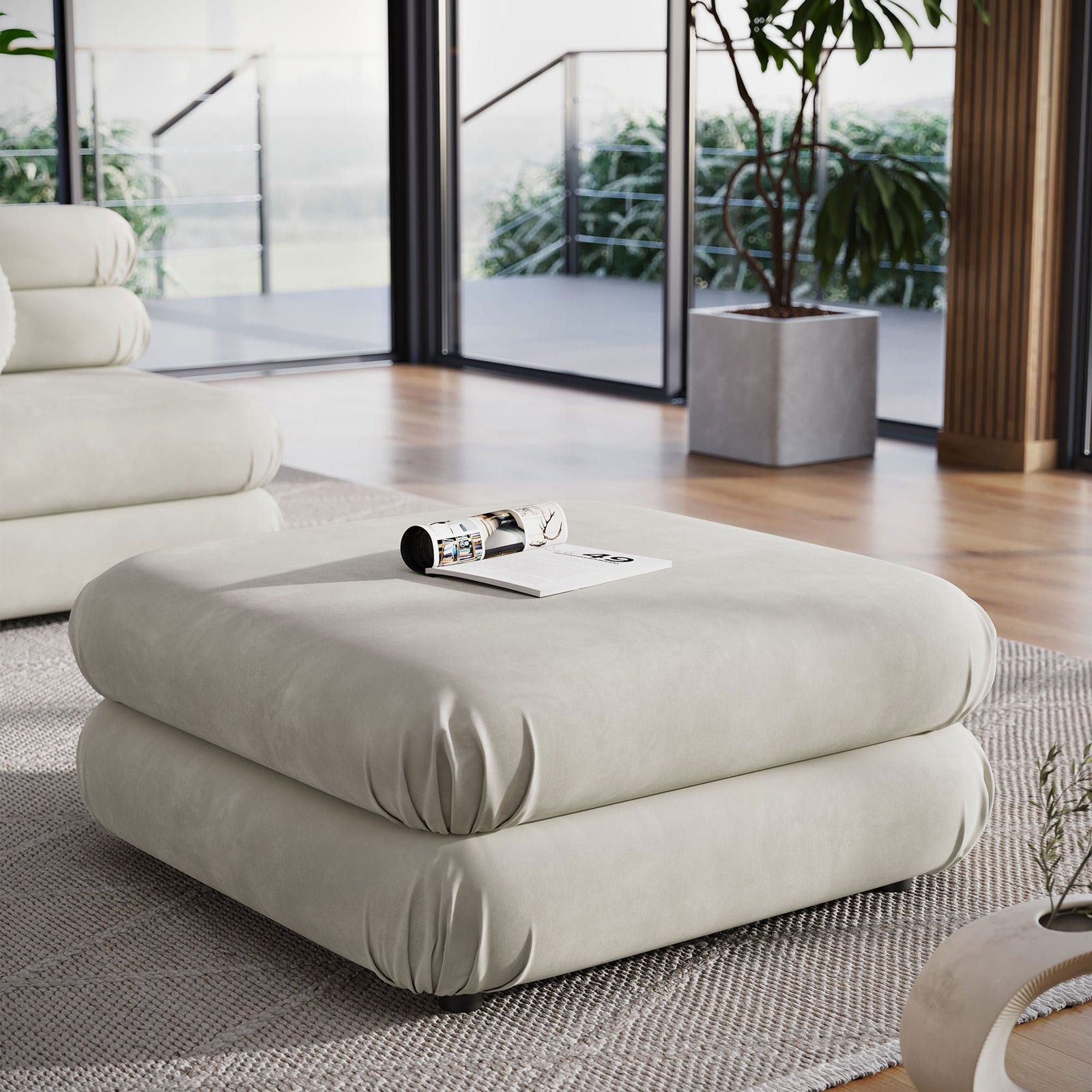 Almond velvet ottoman bringing cushioned comfort to a bright open living space || EEI-6899-ALM || front_angle_room