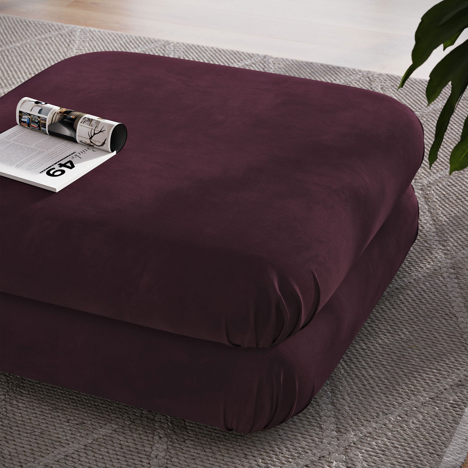 Mulberry performance velvet ottoman used as a soft coffee table on a textured area rug || EEI-6899-MUL || front_angle_room