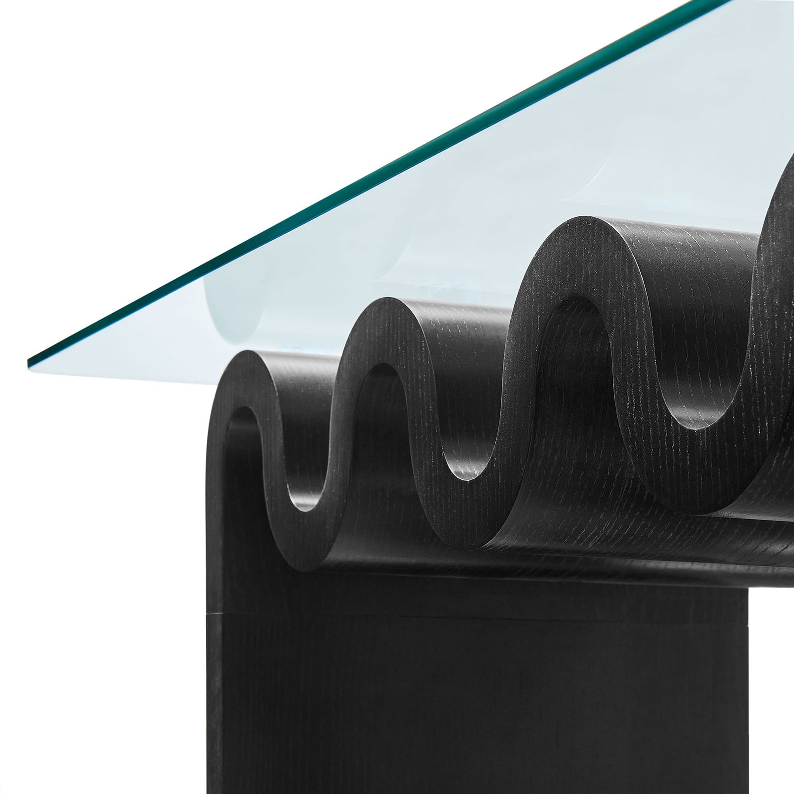 Polished glass edge pairs with textured black wood grain along the sculptural wave base. || EEI-6900-BLK || detail_studio