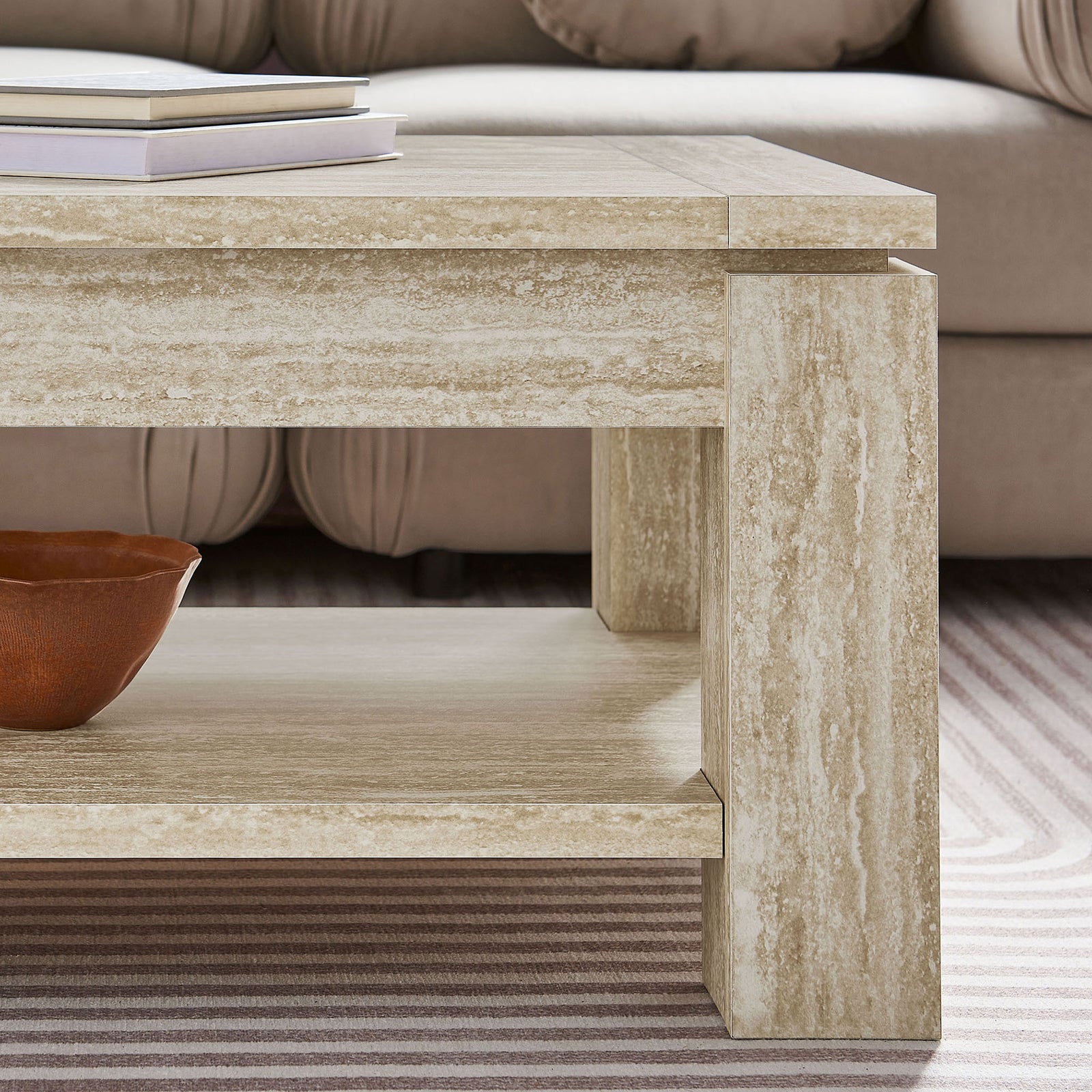 Textured travertine-look finish pairs with strong square legs and an open shelf for everyday essentials || EEI-6908-TRA || detail_room