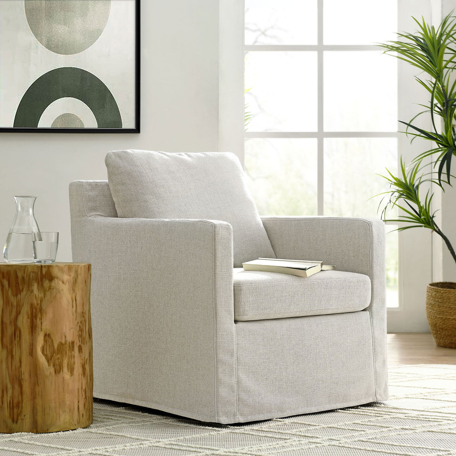 Elevate your living space with a cozy, swivel armchair wrapped in easy-care, linen-look slipcover || EEI-6910-LIN || front_angle_room