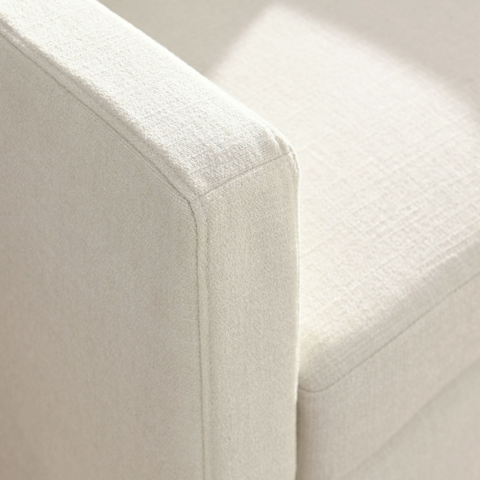 Tailored seams and softly textured fabric elevate the arm and seat details || EEI-6910-SAL || detail_studio