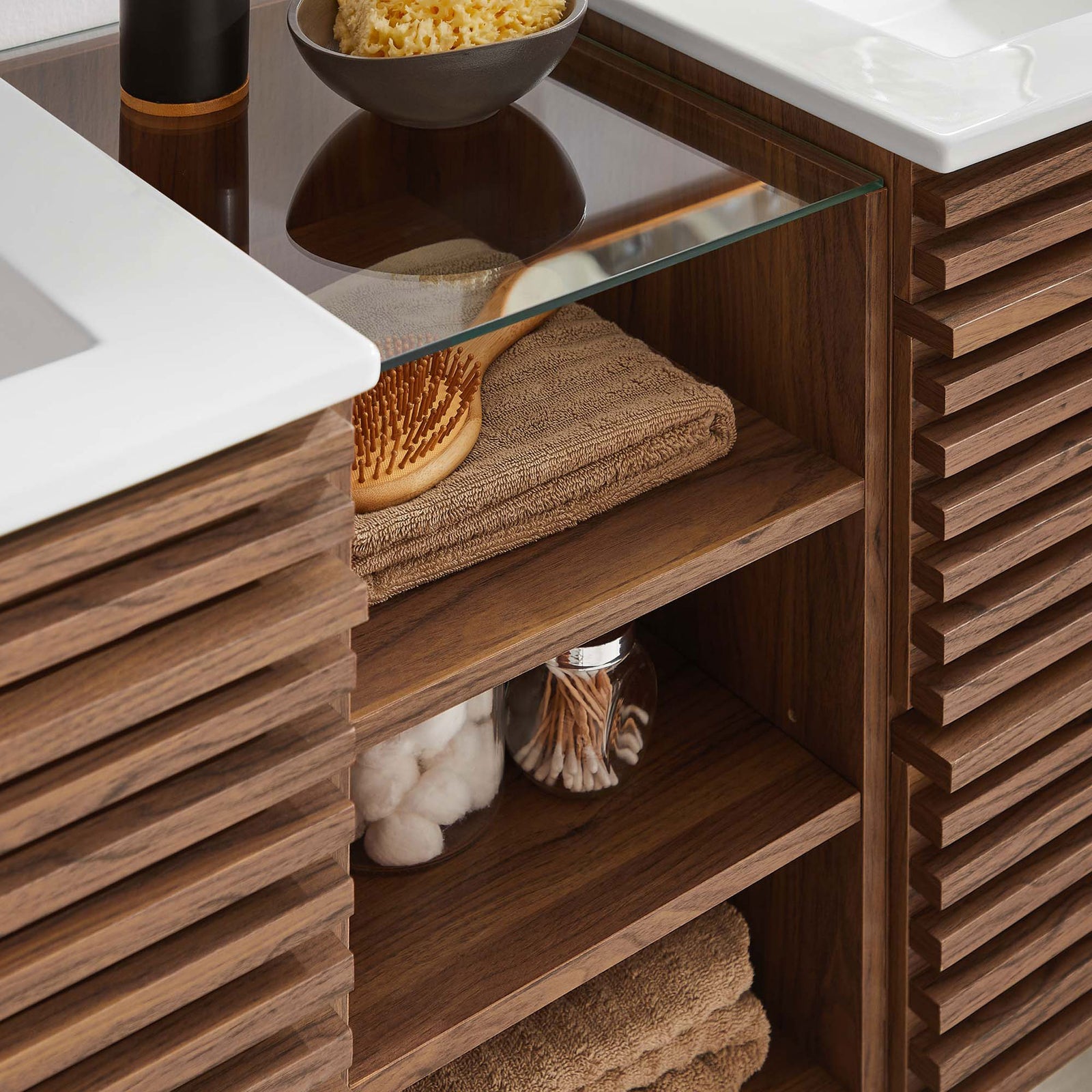 Glass shelf and open cubbies neatly organize bath essentials between the dual sinks || EEI-6941-WAL-WHI || storage_room