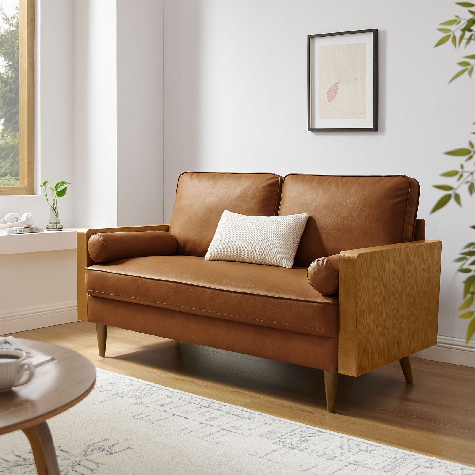 Walnut tan mid-century loveseat with wood arms bringing warmth to a light, airy living room || EEI-6943-WAL-TAN || front_angle_room