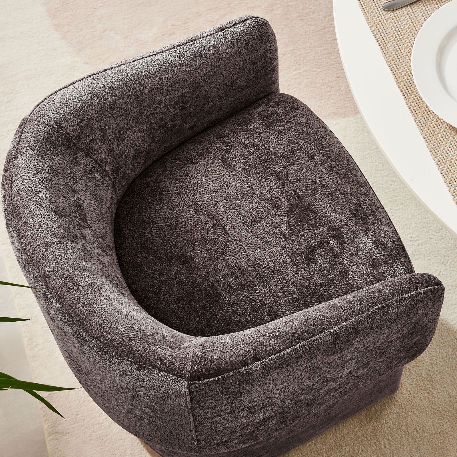 Curved barrel back dining chair with rounded seat and continuous backrest, styled beside a soft neutral rug. || EEI-6951-CHB || top_room