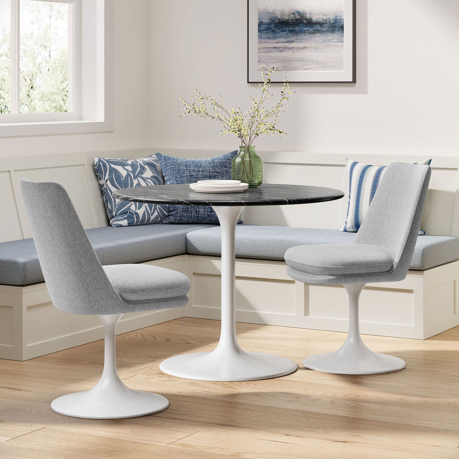 Pair of light gray pedestal dining chairs styled with a round white and black pedestal table in a bright nook || EEI-6953-WHI-HLG || front_angle_room
