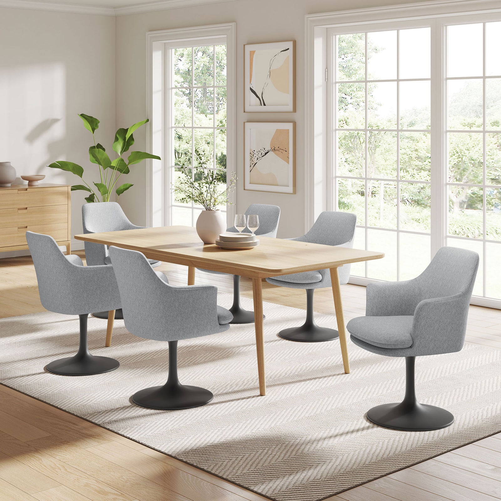 Gray Lippa armchair shown around a light wood dining table in a bright modern dining room || EEI-6956-BLK-HLG || front_angle_room