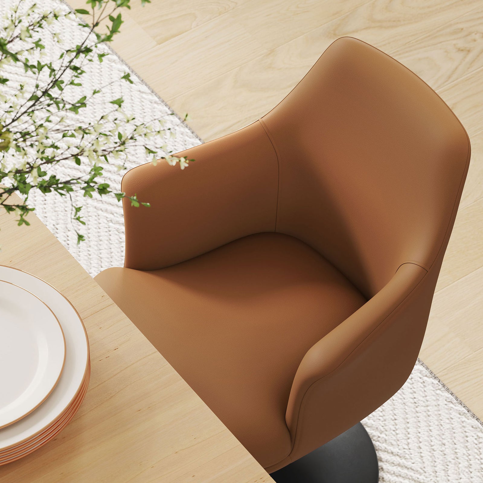 Tan vegan leather armchair tucked at the table, revealing the contoured seat and supportive wraparound backrest || EEI-6958-BLK-TAN || detail_room