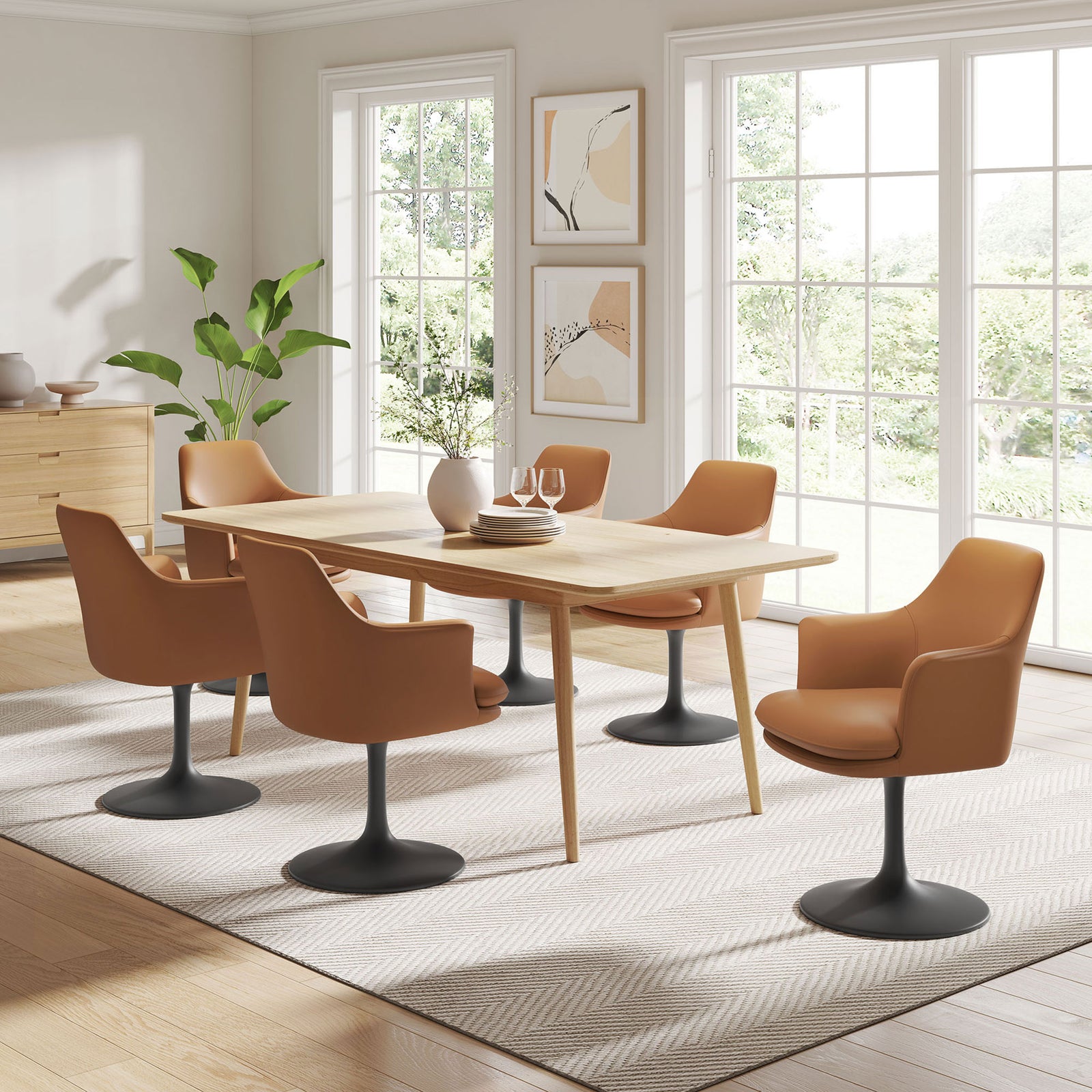 Multiple tan vegan leather pedestal armchairs arranged around a light wood dining table in an airy, sunlit room || EEI-6958-BLK-TAN || front_room