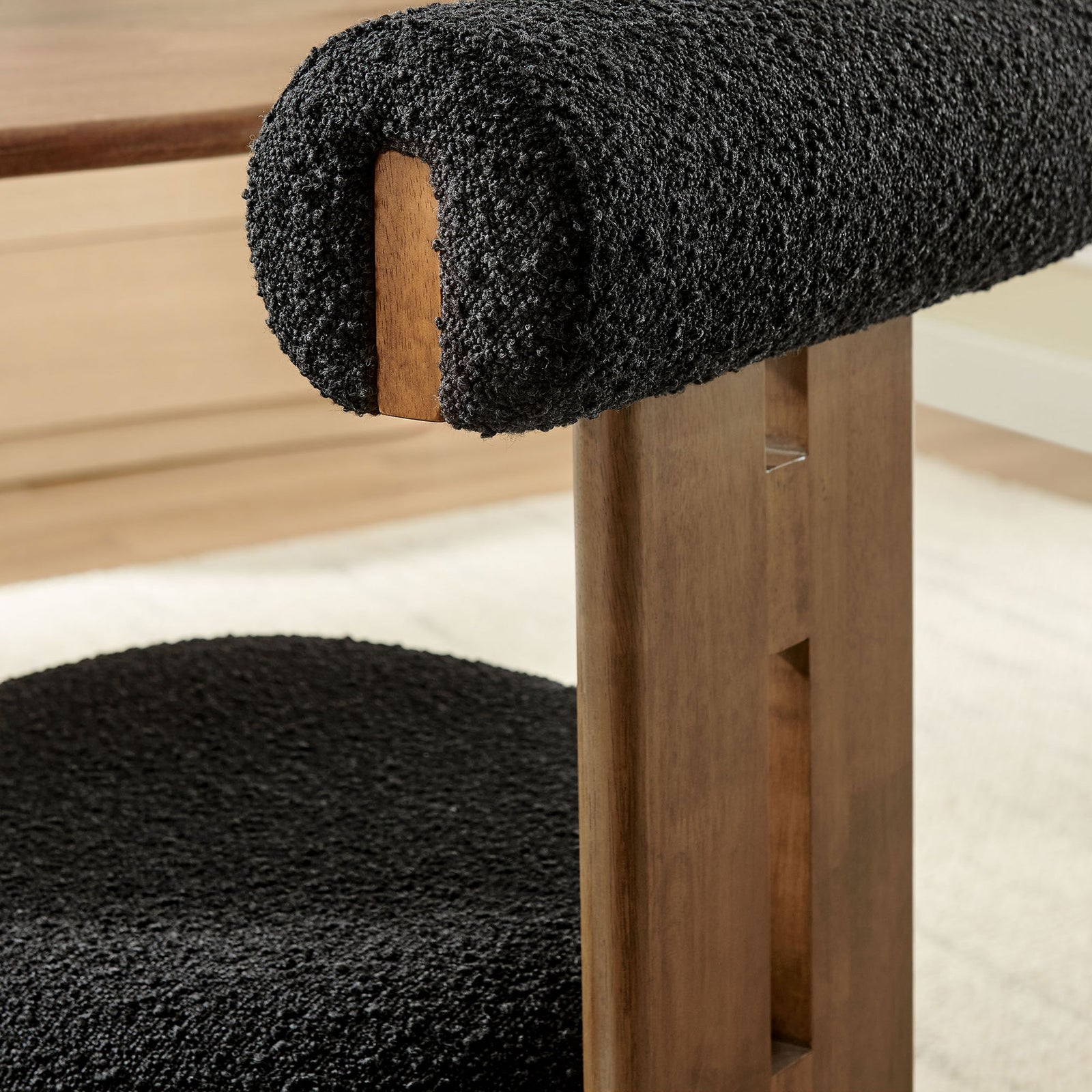 Walnut frame and boucle roll pillow backrest styled in a bright contemporary dining space || EEI-6960-WAL-BLK || detail_room