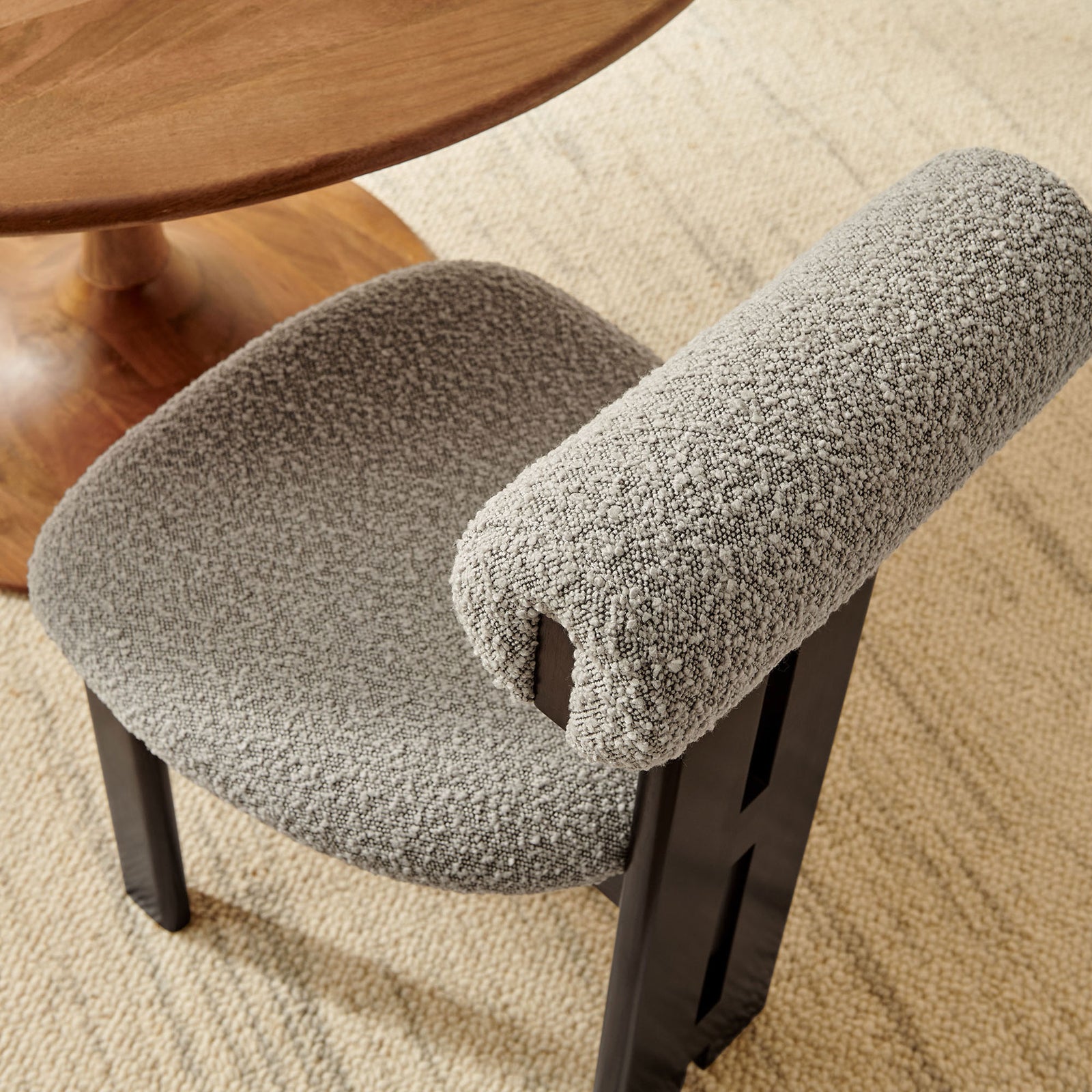 Taupe boucle dining chair styled by a round wood table and neutral rug for a soft, textural dining look. || EEI-6960-WEN-TAU || detail_room