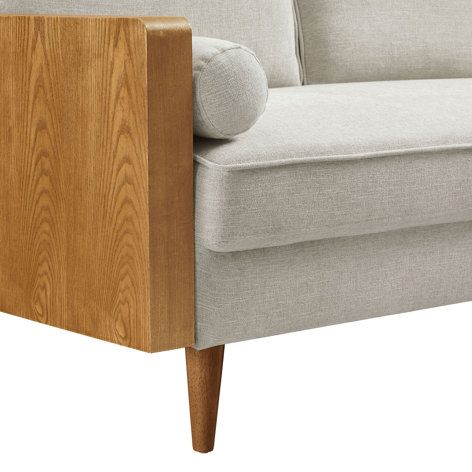 Walnut veneer arm, tapered wood leg, and soft heathered ivory upholstery highlighting the sofa's texture. || EEI-6961-WAL-HEI || detail_studio