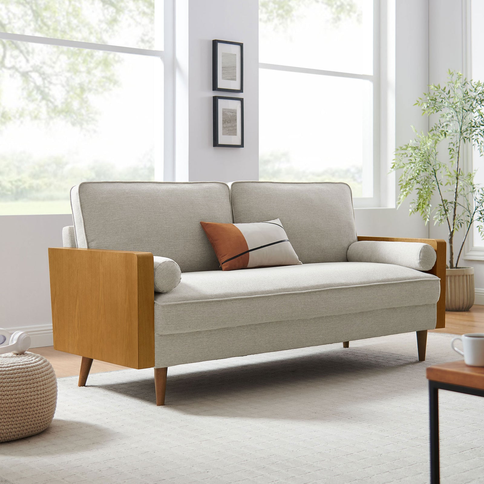 Kellan sofa in heathered ivory fabric bringing mid-century warmth to a bright, airy living room. || EEI-6961-WAL-HEI || front_angle_room