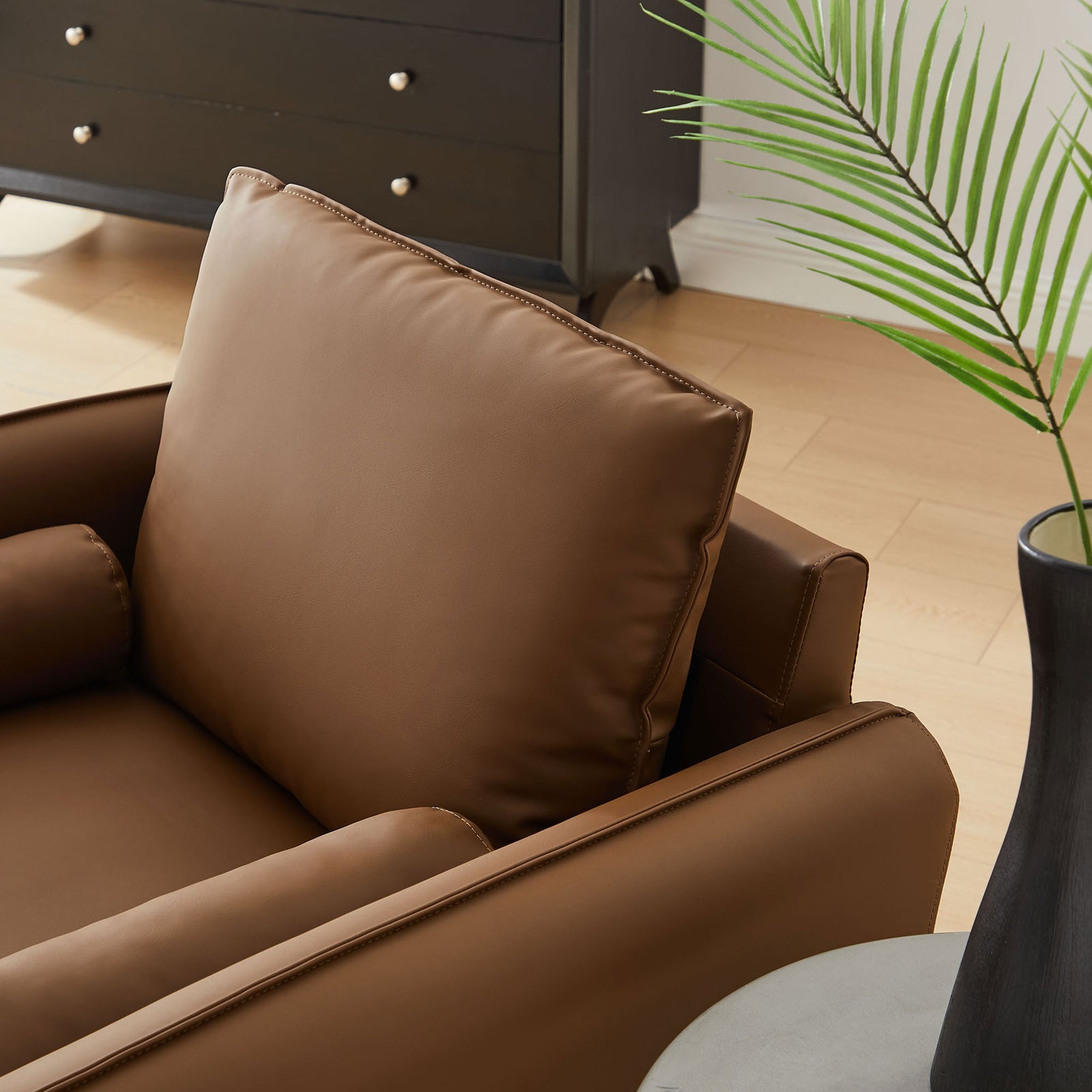 Soft back cushion and bolster pillow detail add lounge-worthy comfort || EEI-6973-BRN || detail_room