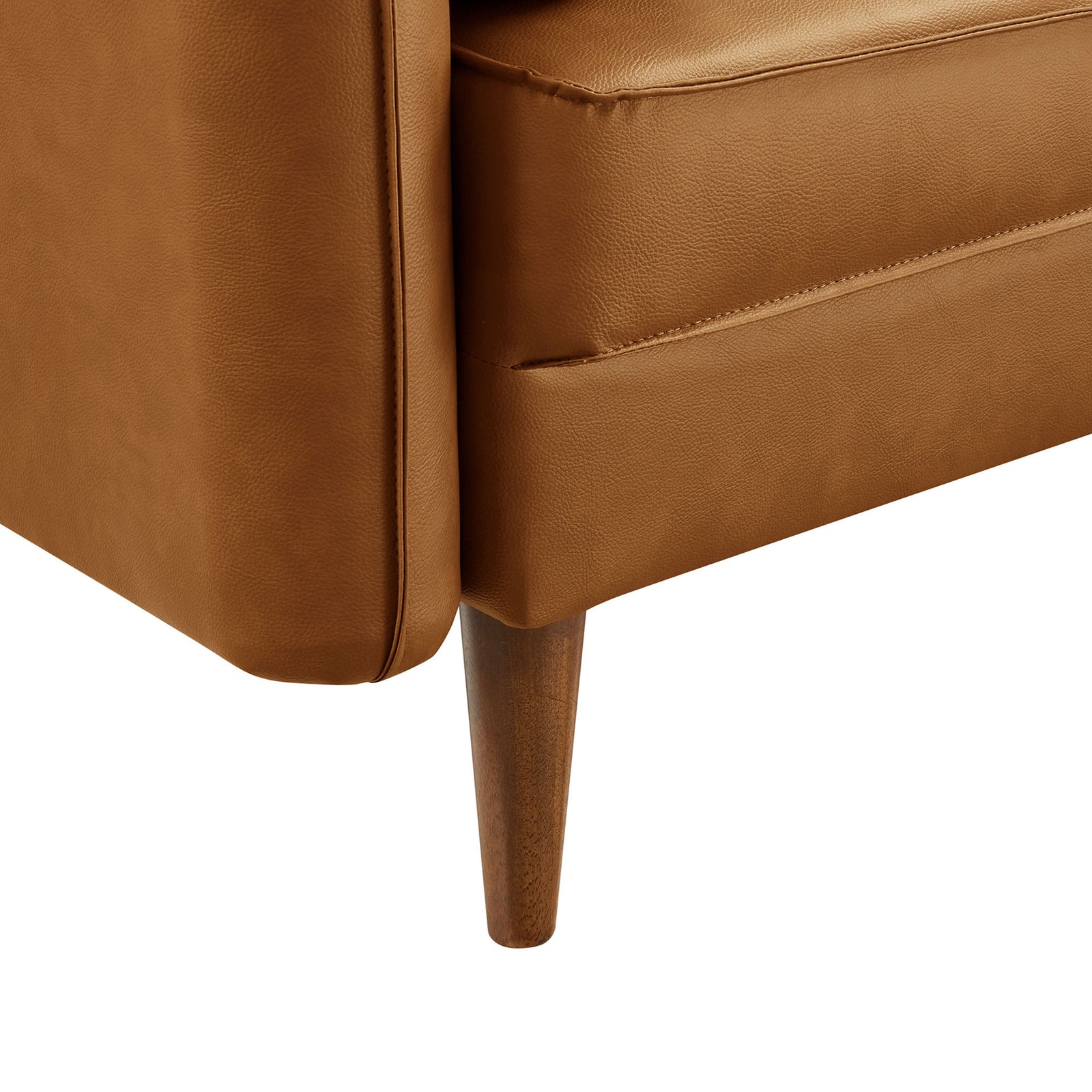 Tapered wood leg and tailored tan vegan leather upholstery at sofa corner || EEI-6975-TAN || leg_studio