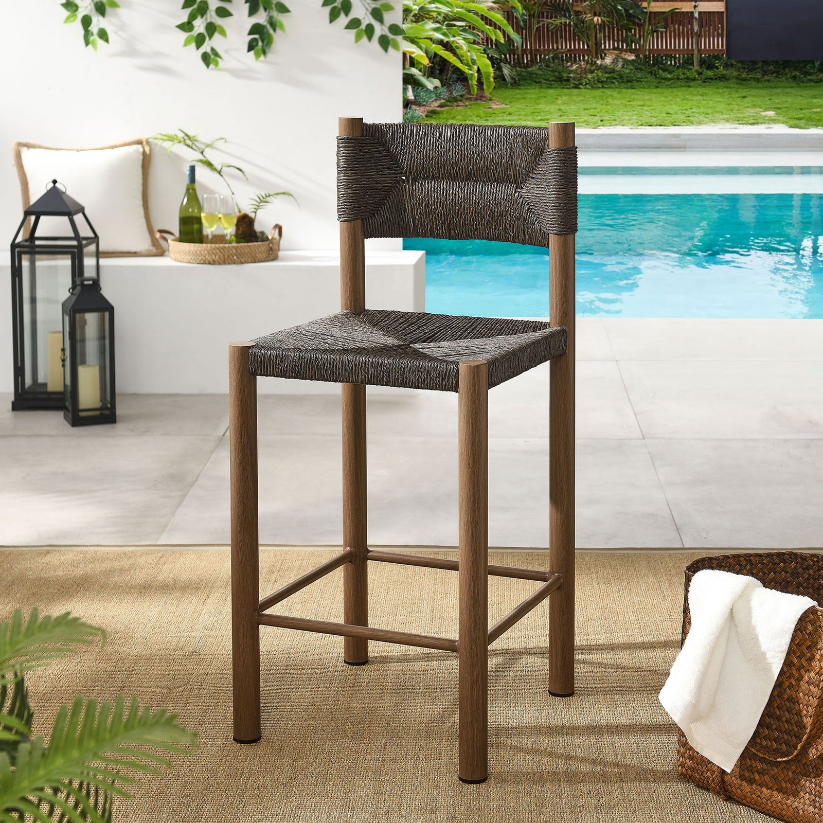 Walnut counter stool brings sophisticated woven texture to a contemporary poolside patio || EEI-6983-WAL || front_angle_room