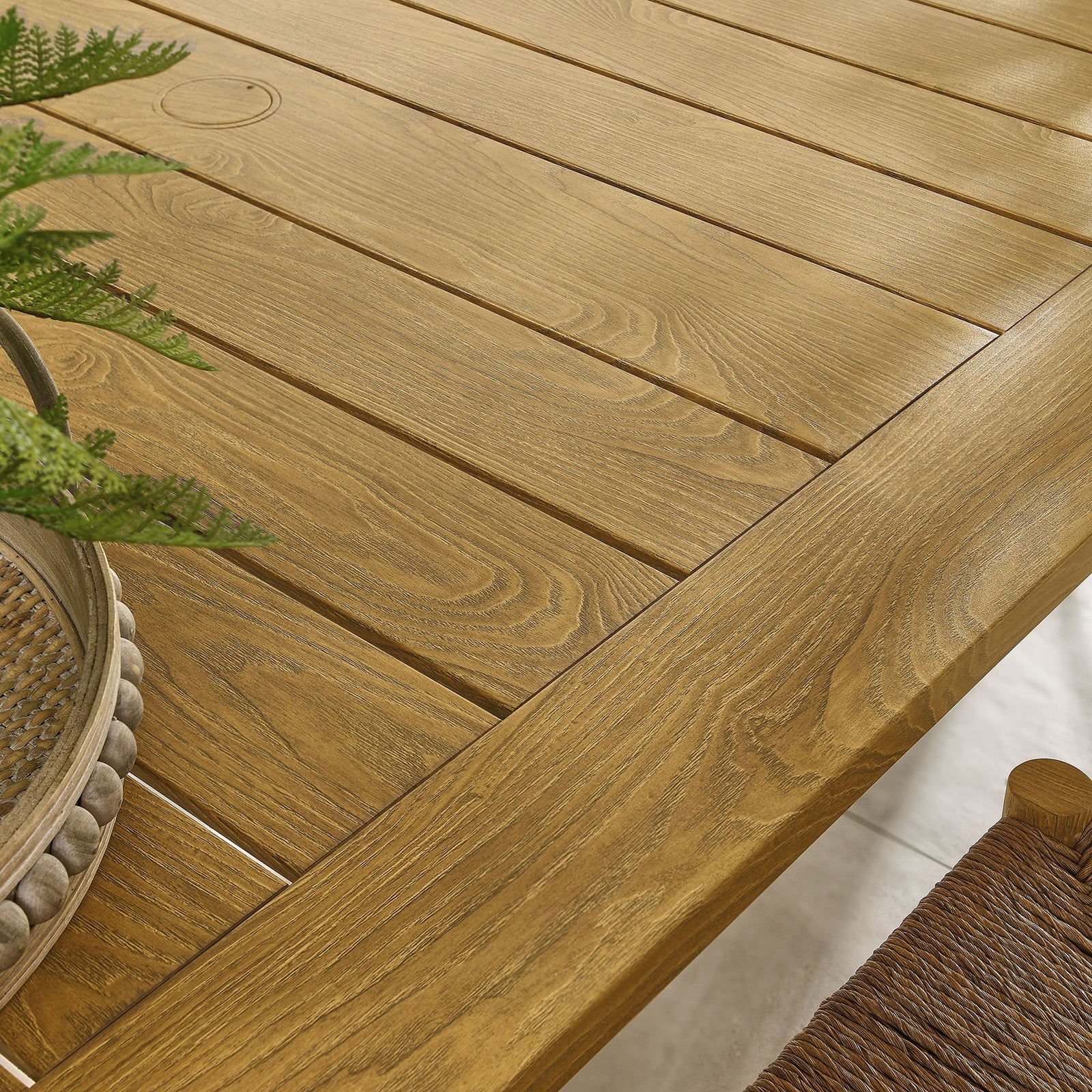 Warm natural wood-grain slats pair with woven seating and greenery for inviting patio style || EEI-6985-NAT || swatch_room
