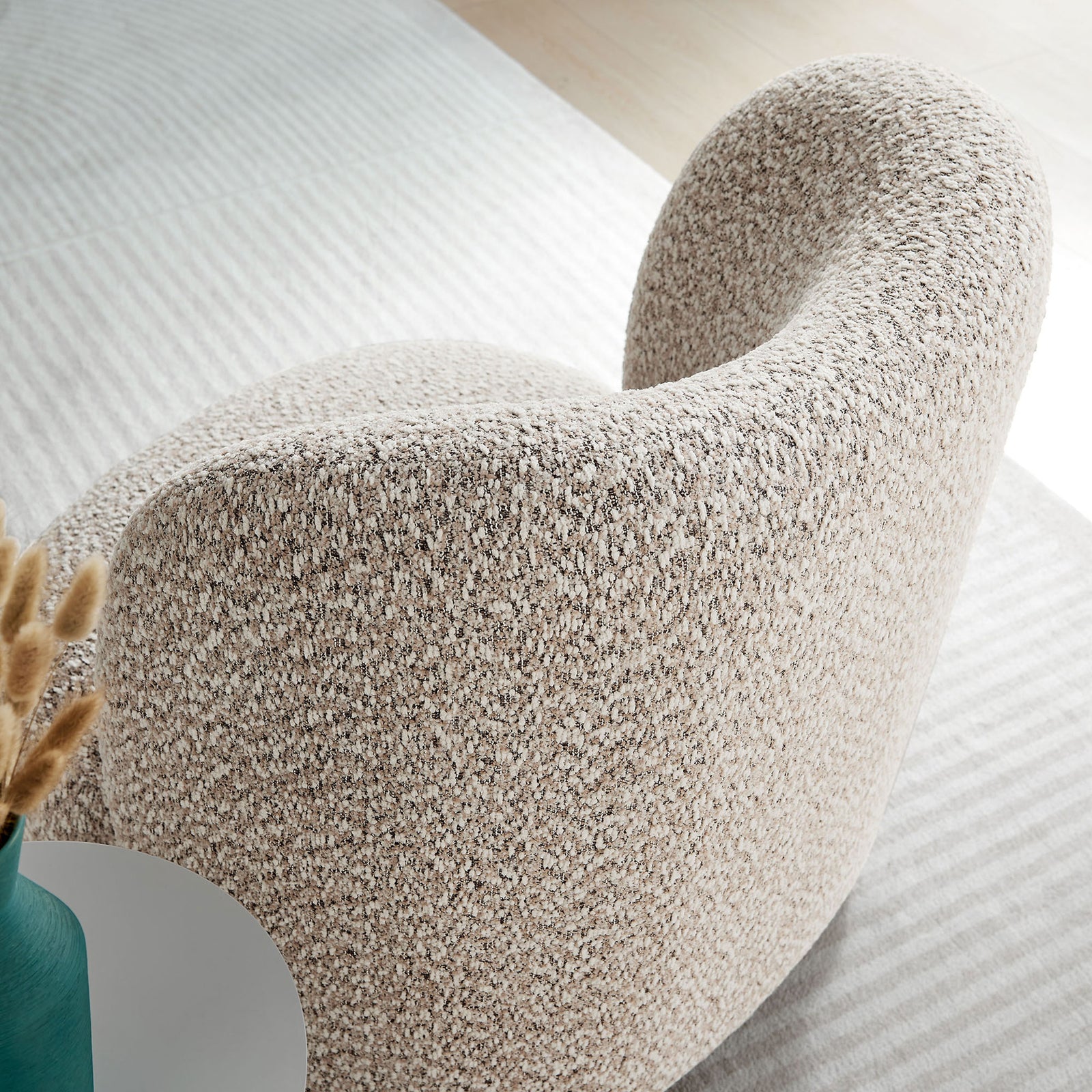Textured boucle and organic curves deliver inviting tactile appeal || EEI-6989-COR-WAL || detail_room