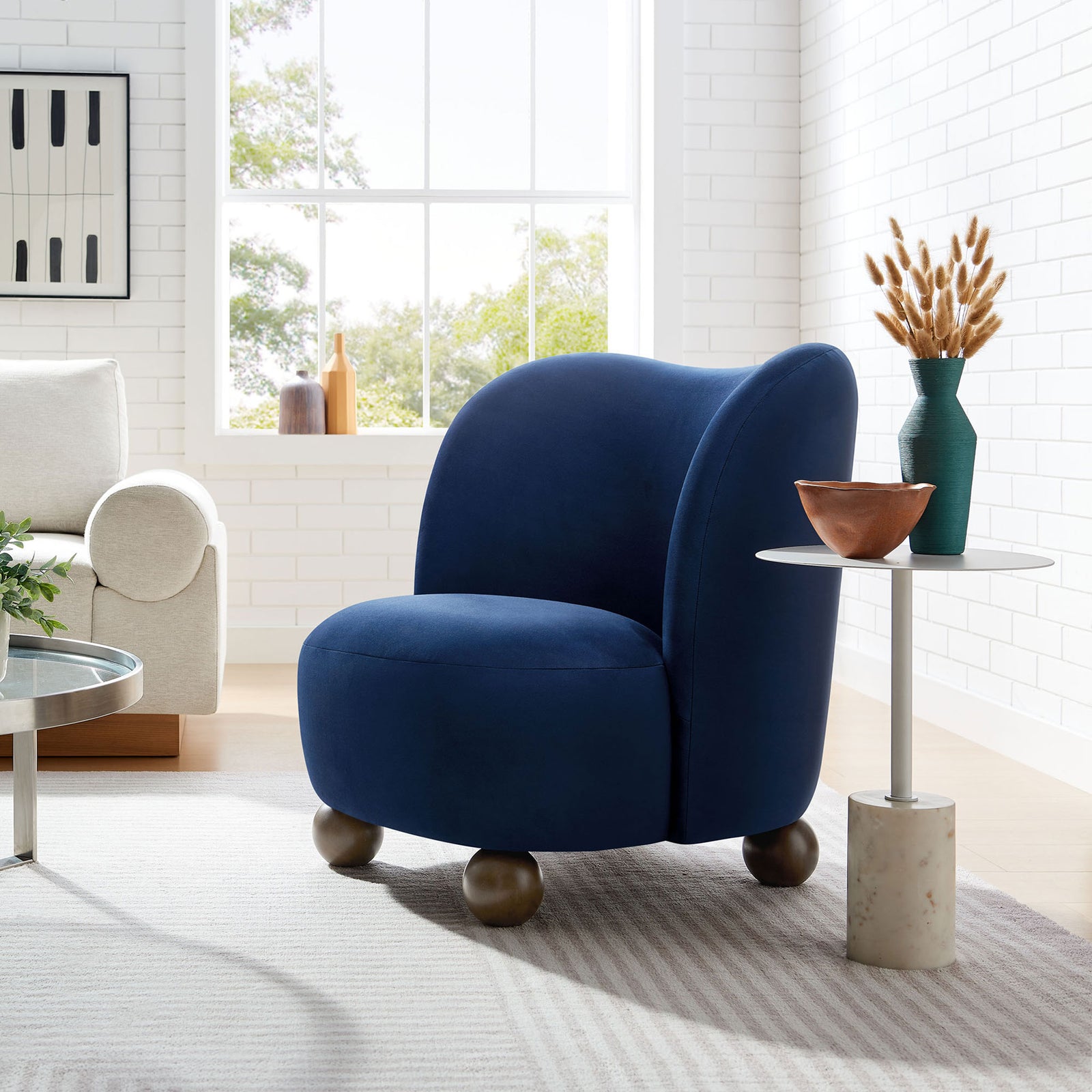 Midnight blue velvet accent chair brings a cozy, modern touch to the living room || EEI-6990-MID-WAL || front_angle_room