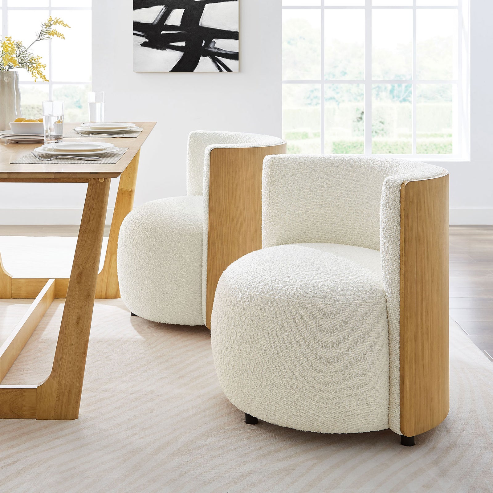 Soft boucle upholstery and a supportive wraparound back bring comfort to dining or lounge areas || EEI-6994-NAT-IVO || front_angle_room