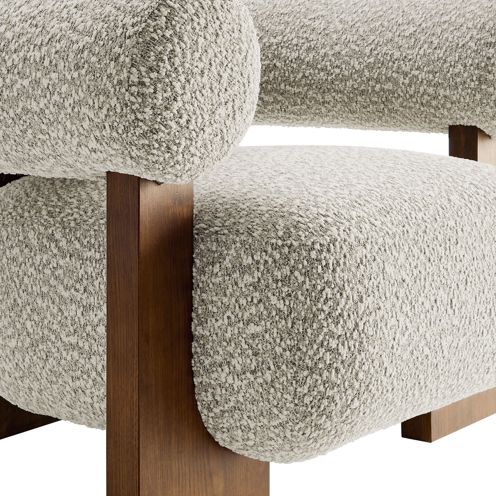 Nubby boucle fabric pairs with a smooth ash wood finish for a rich, tactile contrast. || EEI-6996-RIV || detail_studio