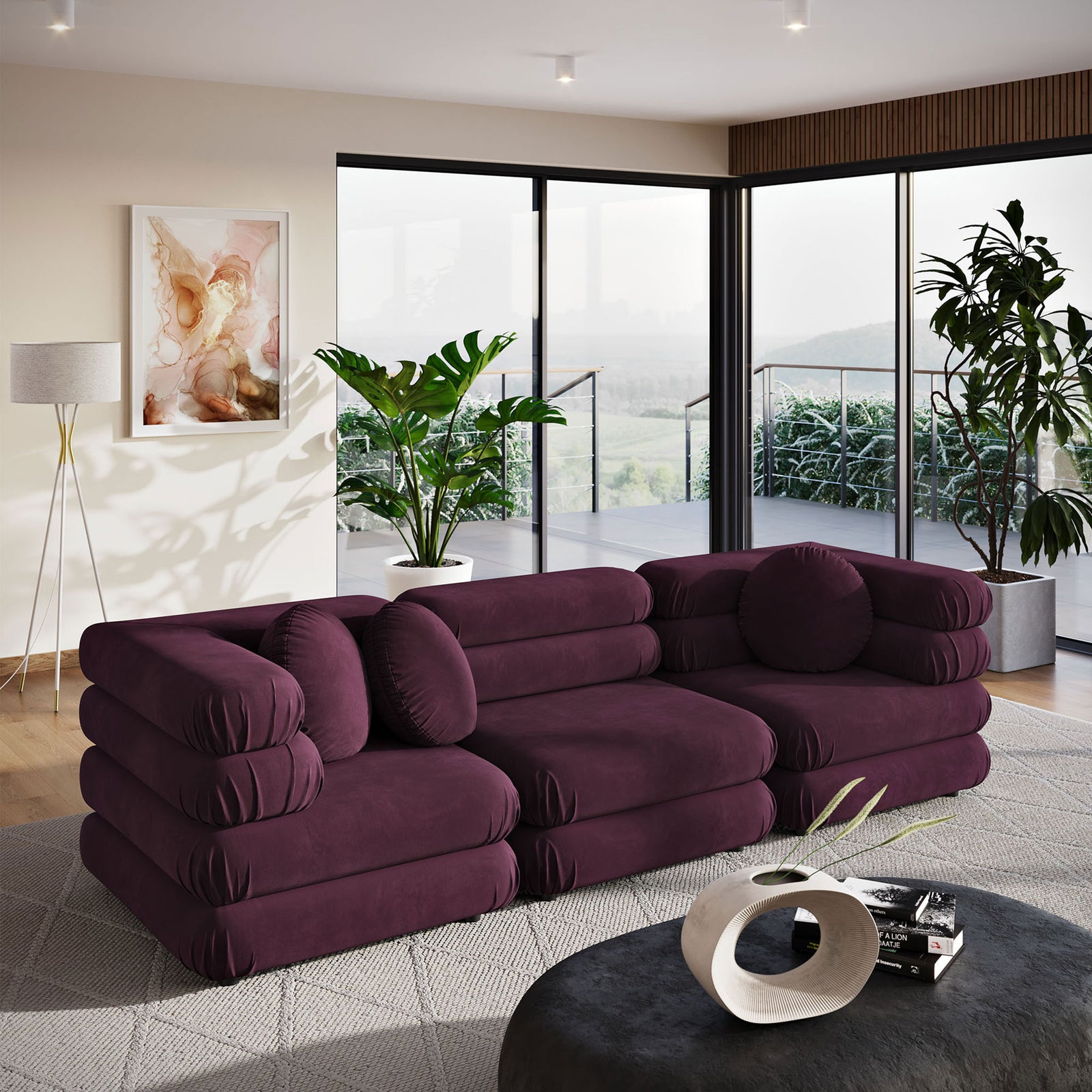 Deep mulberry velvet sectional adding plush layered comfort and sculptural curves to a modern open living room || EEI-7003-MUL || front_angle_room
