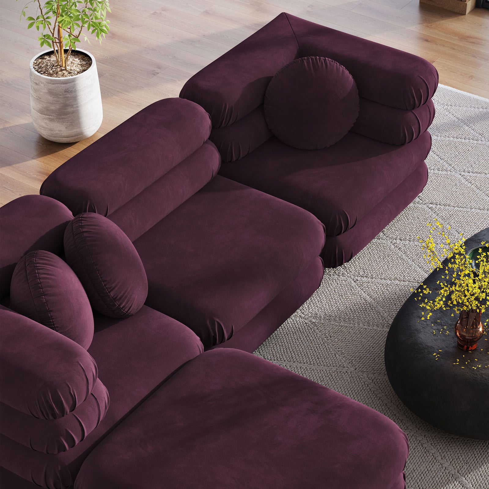 Layered cushions and round pillows showcase the sculptural lines of this mulberry modular sectional with chaise || EEI-7004-MUL || top_angle_room