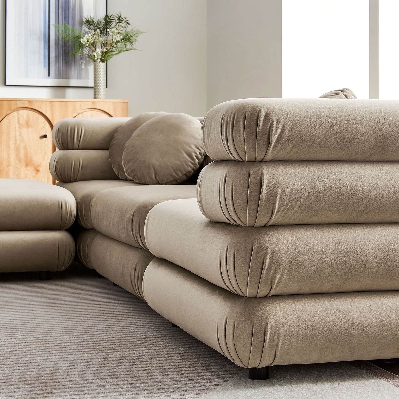 Taupe velvet cushions and round pillow highlighting the plush, layered upholstery texture || EEI-7004-TAU || detail_room
