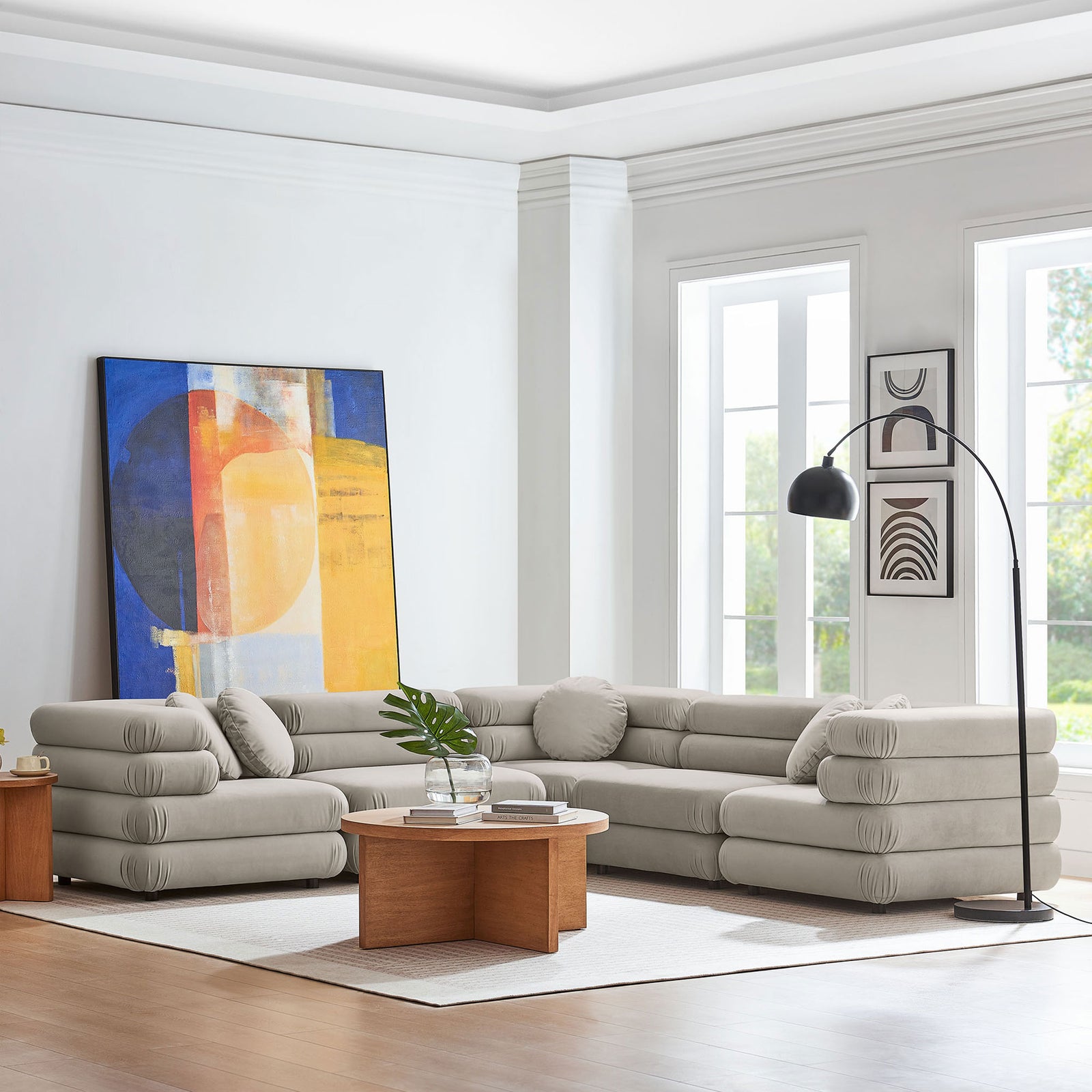 Almond modular sectional sofa styled in a bright living room with wood coffee table and modern wall art || EEI-7005-ALM || front_angle_room