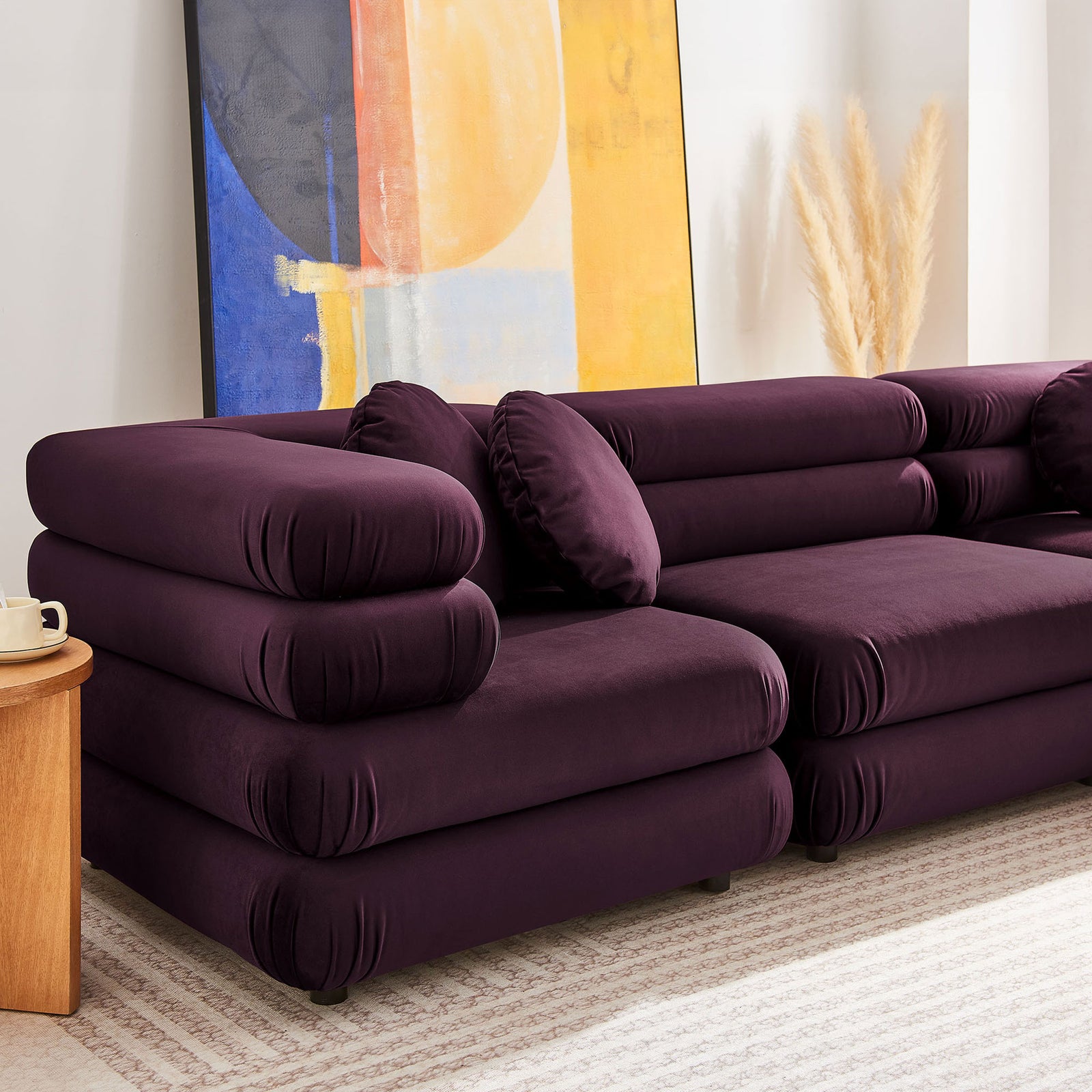 Mulberry velvet modular sofa highlighting rounded bolstered arms and smooth, plush upholstery || EEI-7005-MUL || detail_room