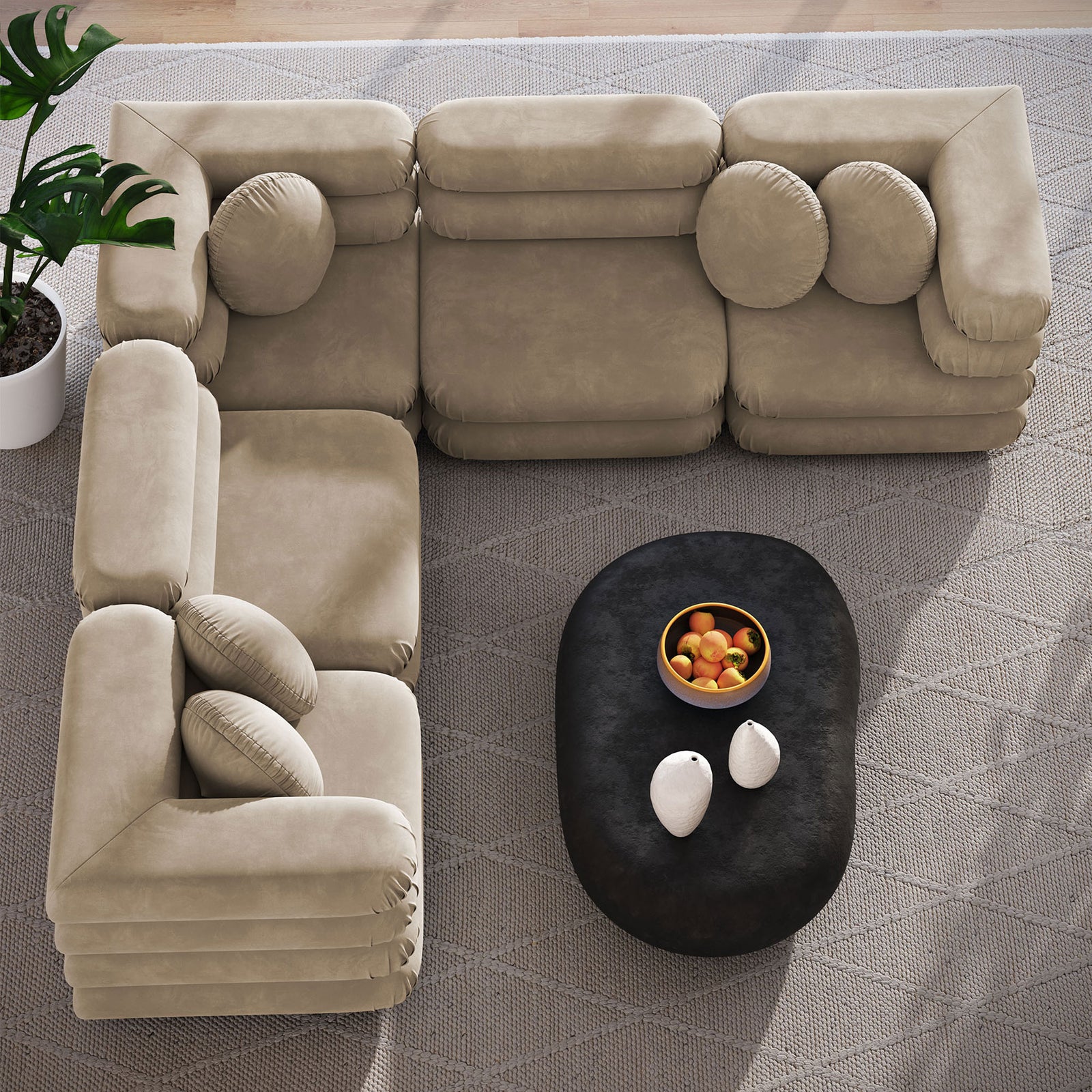 Taupe velvet sectional forming an inviting L-shape around a black coffee table on a textured rug || EEI-7005-TAU || top_angle_room