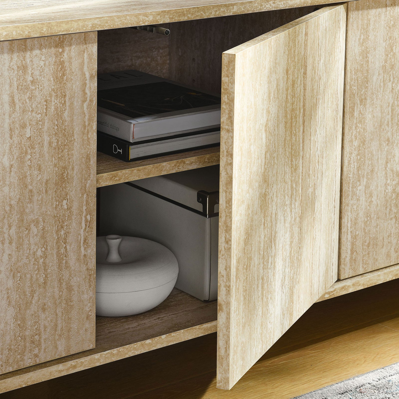 Interior storage of the Overture TV stand styled with decor to show adjustable shelving capacity || EEI-7016-TRA || storage_open_room