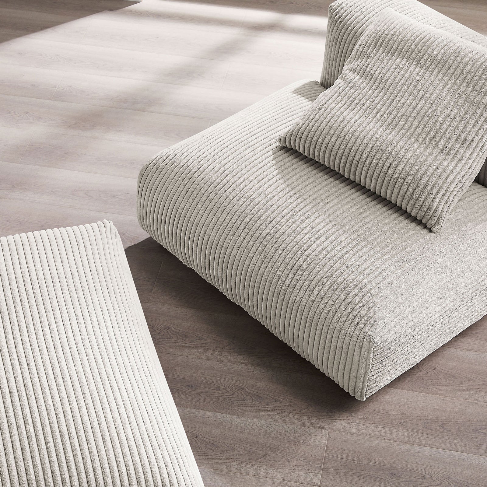 Ribbed corduroy upholstery with plush cushioning and softly rounded edges || EEI-7022-ALM || detail_room