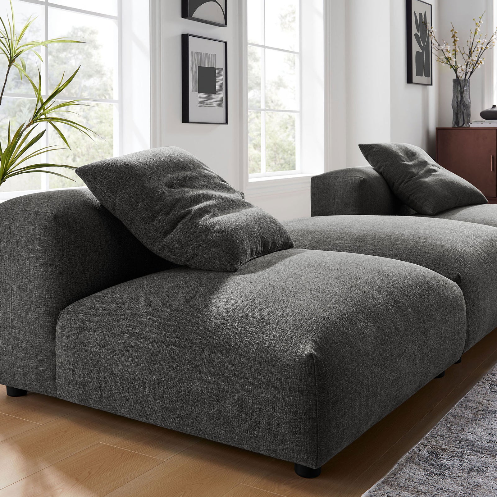 Charcoal sectional highlighting textured woven fabric and plush pillow comfort || EEI-7029-CHA || detail_room