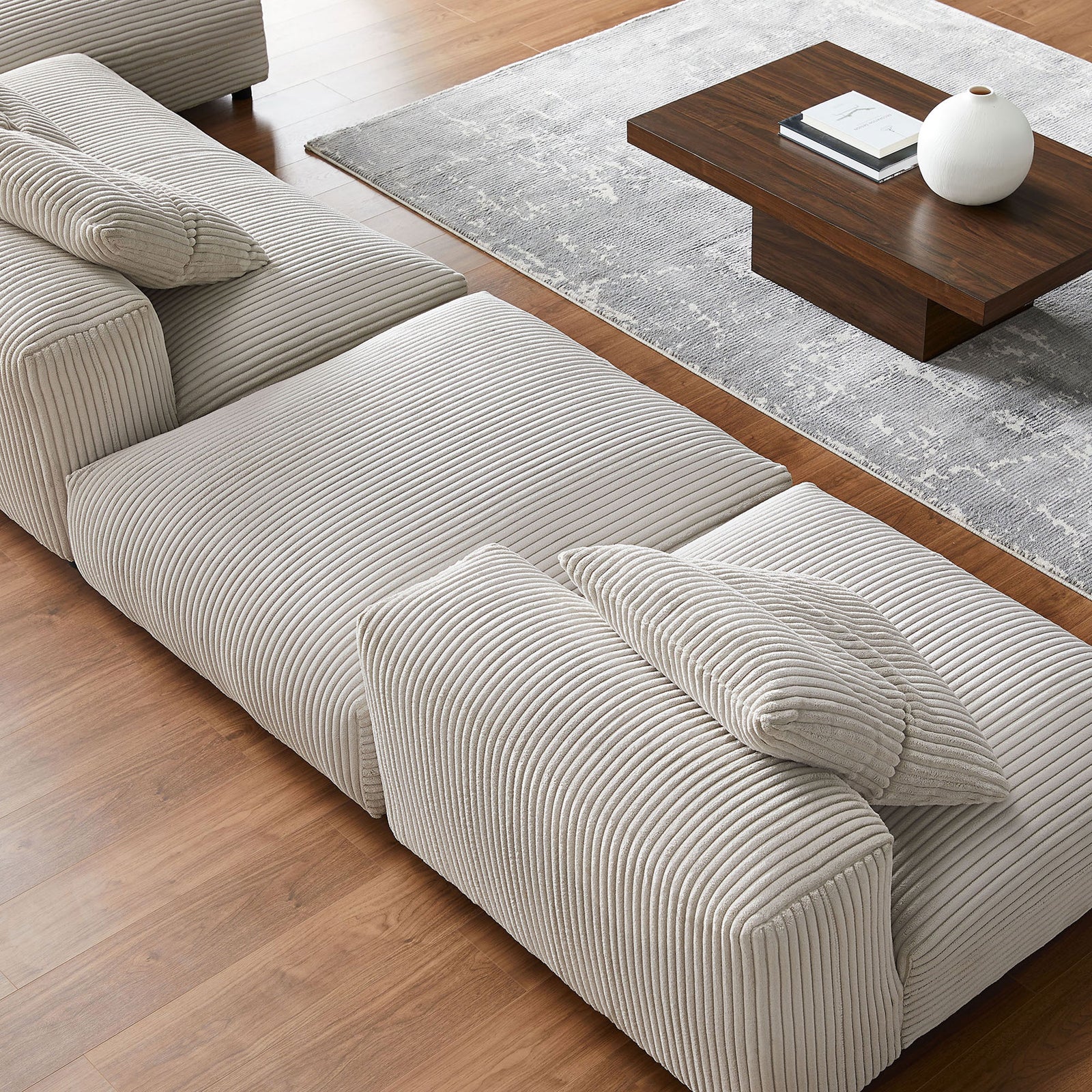 Close-up of almond corduroy cushions and pillows showcasing the ribbed texture and deep, lounge-worthy seats || EEI-7032-ALM || detail_room