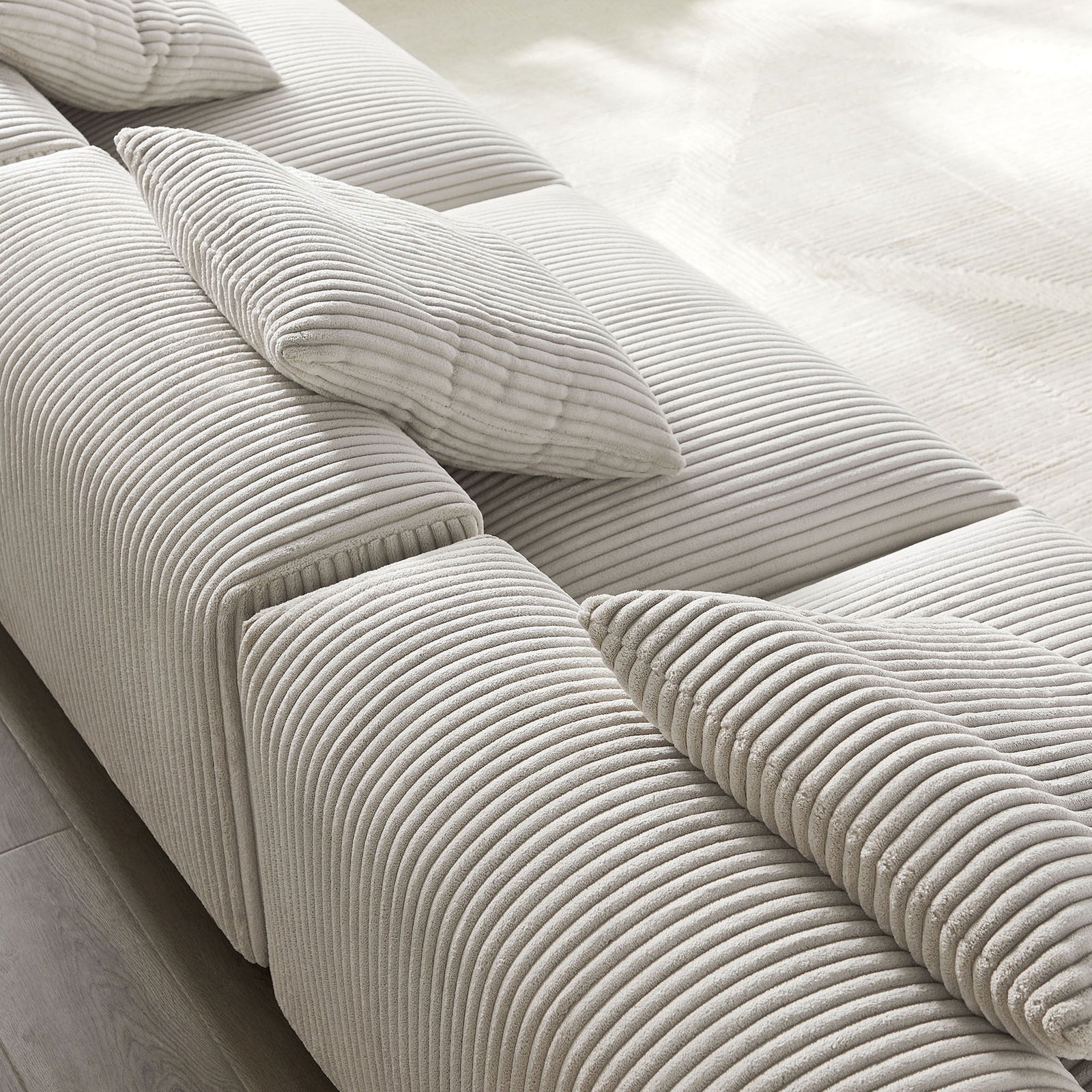 Soft ribbed almond corduroy upholstery with plush cushioning and coordinating throw pillows for relaxed lounging || EEI-7034-ALM || swatch_room