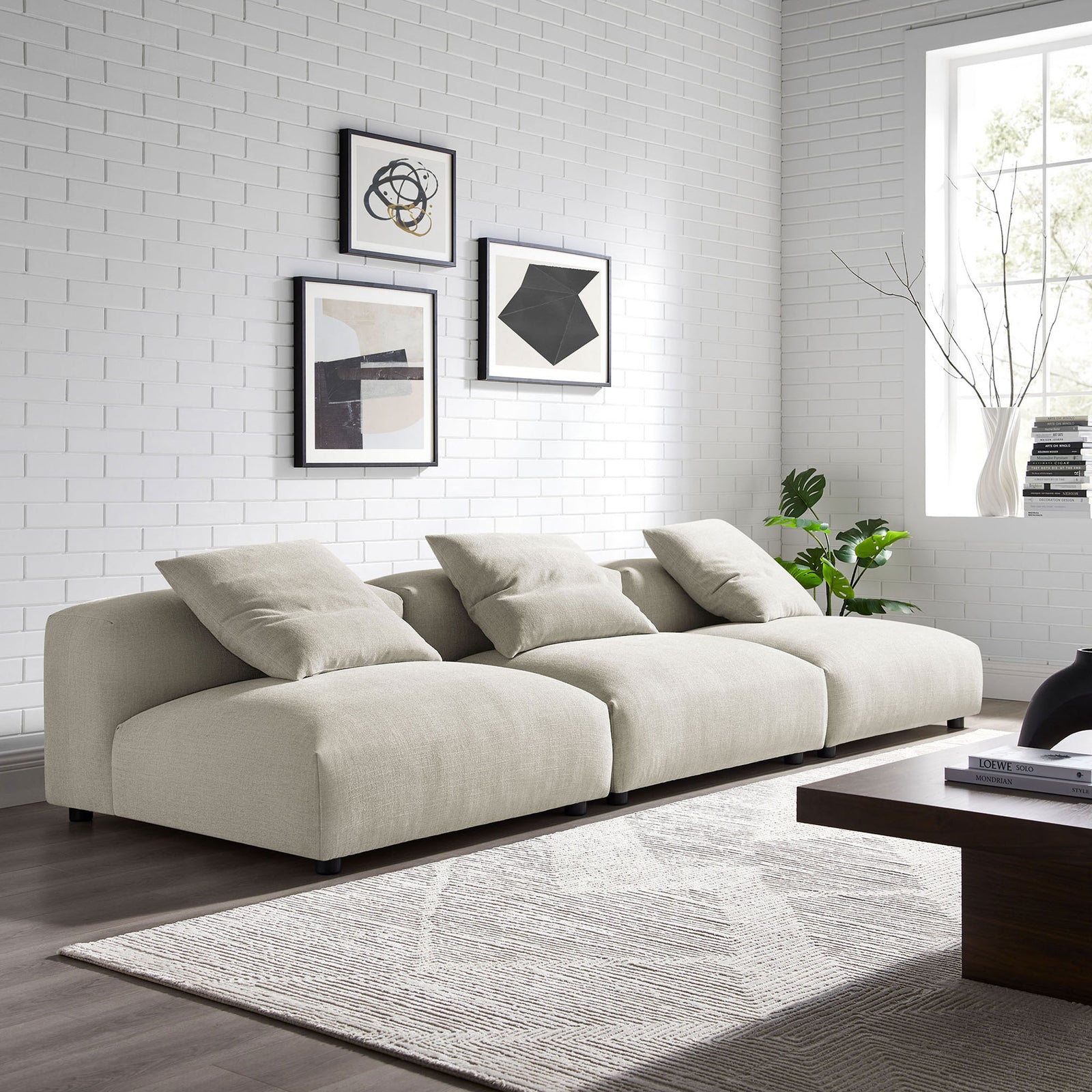 Modular linen sofa styled in a bright living room with accent pillows and low-profile silhouette || EEI-7035-LIN || front_angle_room