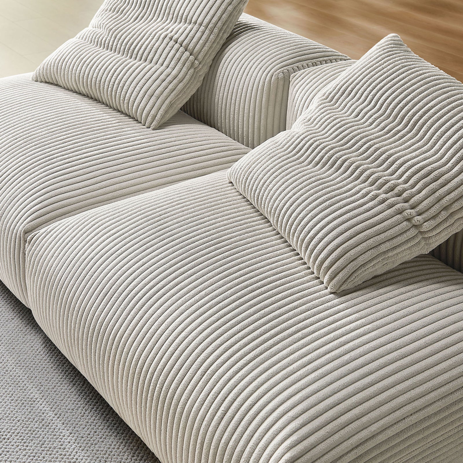 Almond corduroy upholstery with plush accent pillows showcasing the soft ribbed texture || EEI-7036-ALM || detail_room