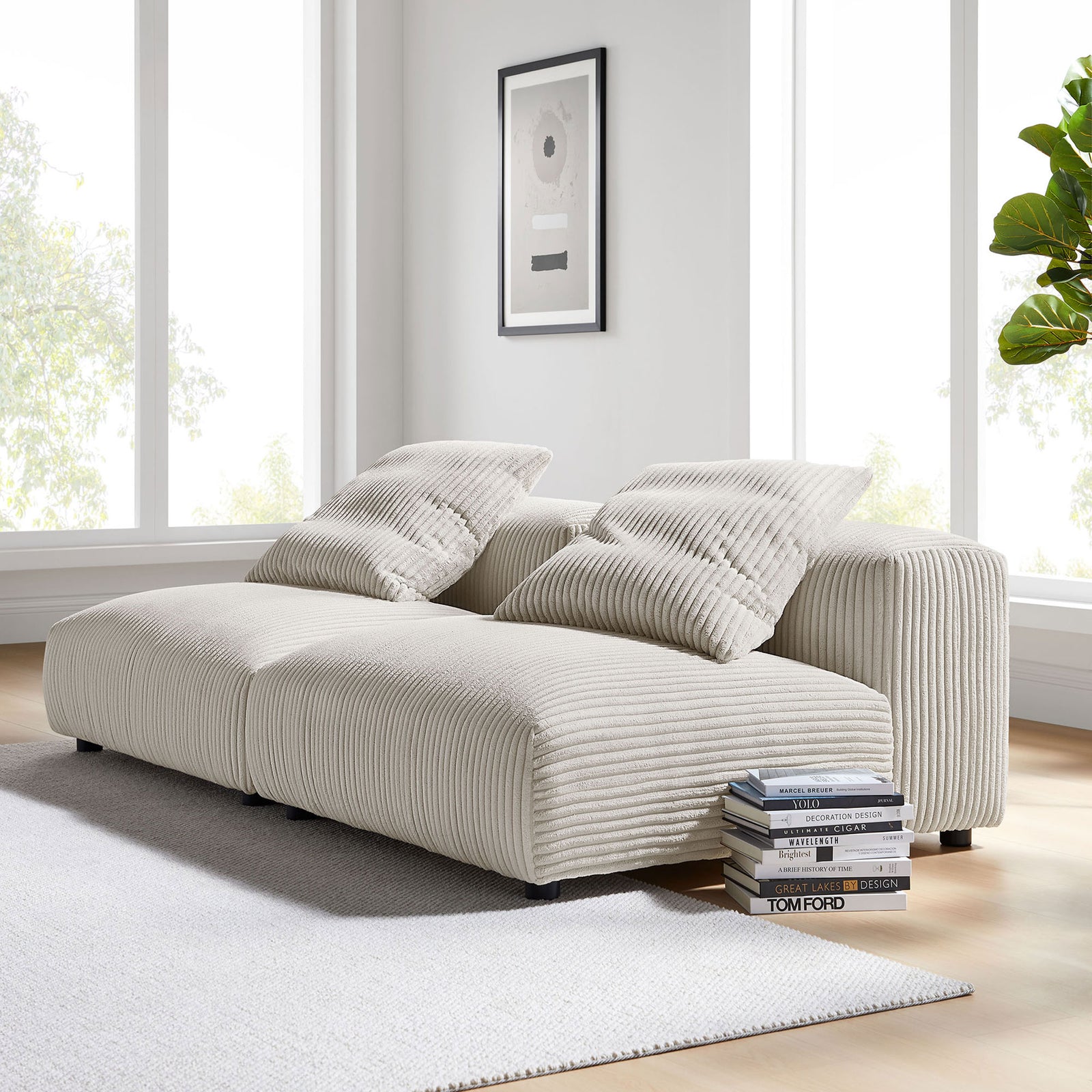 Almond corduroy modular sofa styled in a bright living room with rug, books, and wall art || EEI-7036-ALM || front_angle_room