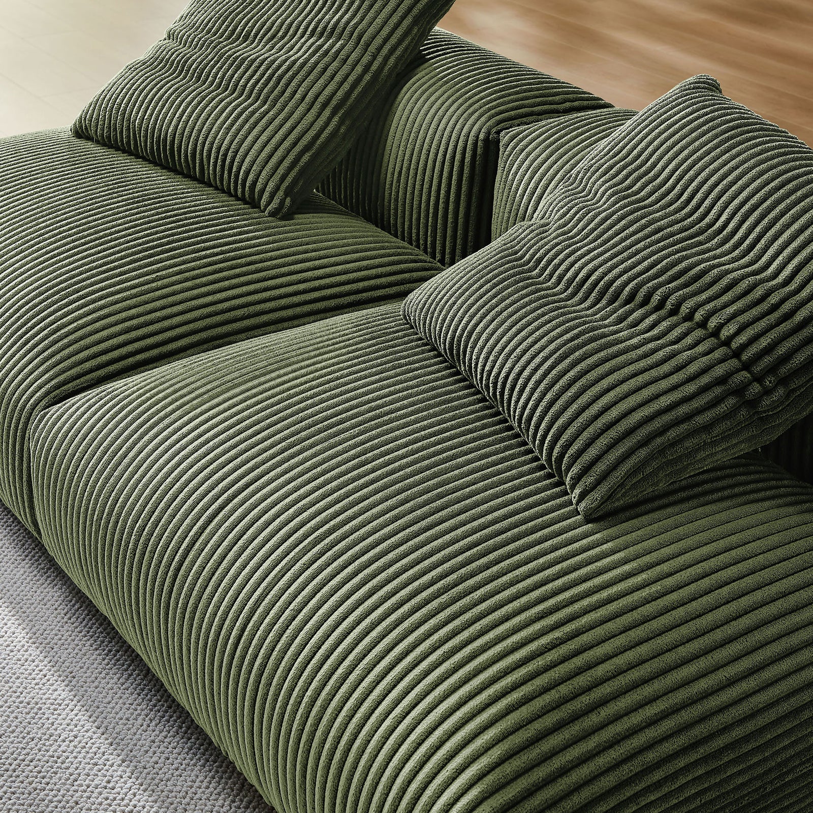 Close-up of plush fern corduroy cushions and wide seat showing the sofa's soft textured ribs || EEI-7036-FRN || detail_room