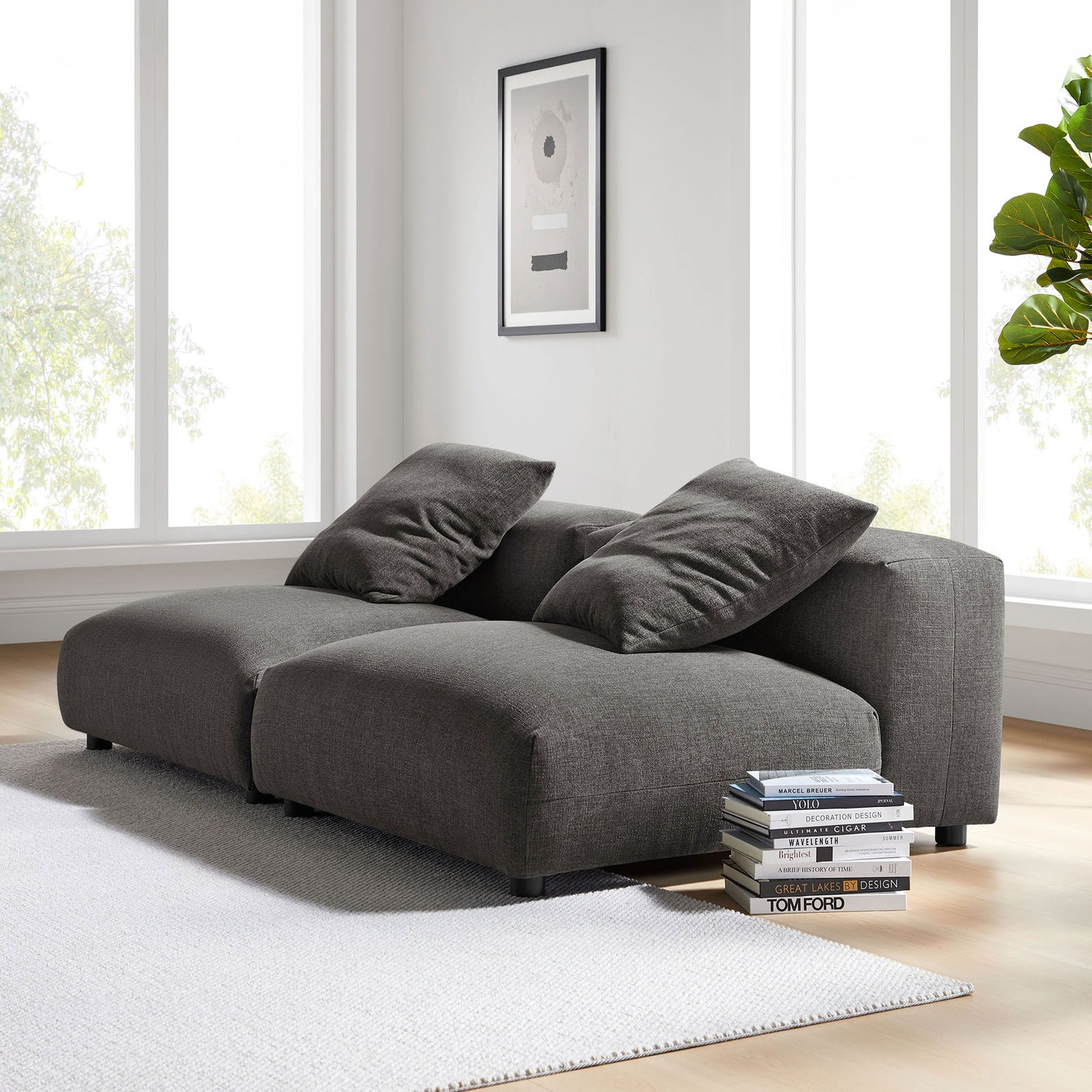 Charcoal modular sofa brings cozy, low-profile seating to a bright, modern living room setting || EEI-7037-CHA || front_angle_multi_room