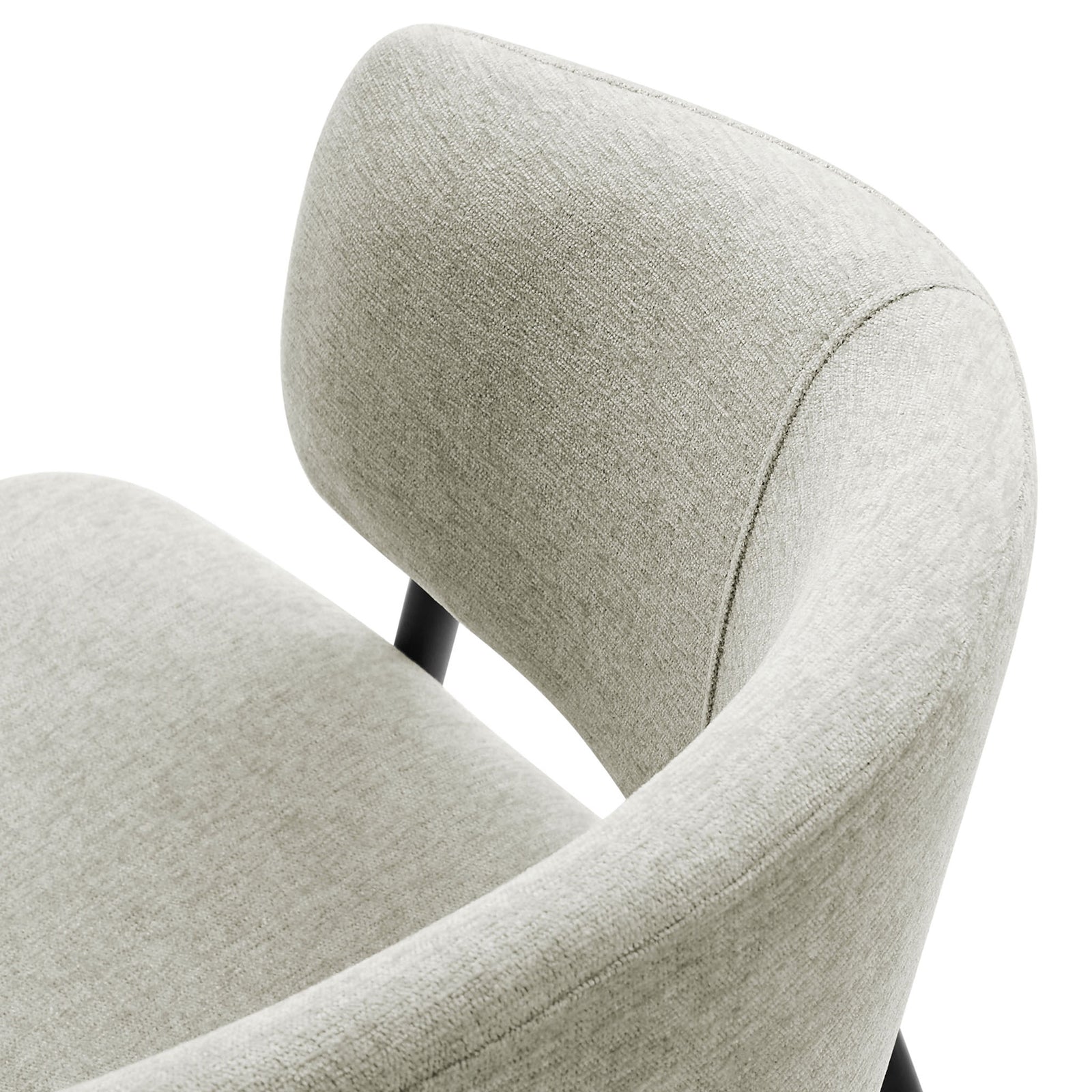 Soft heathered chenille fabric and smooth curved backrest detail of the dining chair. || EEI-7045-TAU-BLK || detail_studio