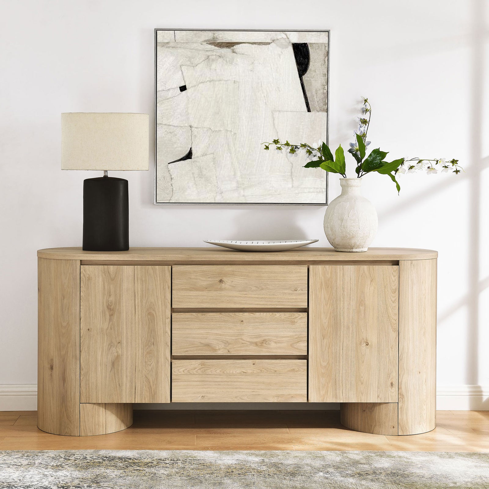 Duval sideboard styled with lamp, vase, and abstract wall art for a clean, modern entryway look || EEI-7050-HCK || front_room
