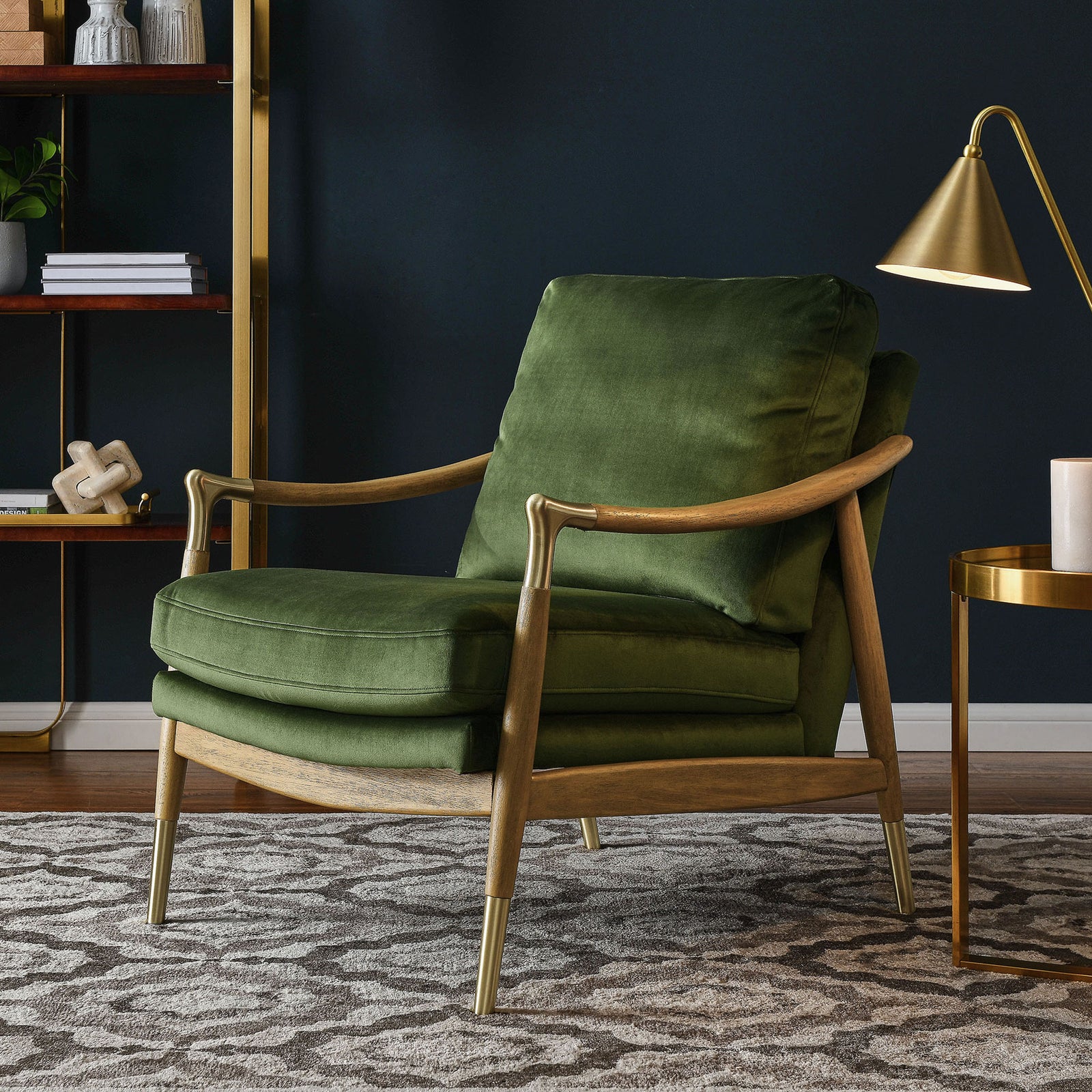 Statement lounge chair elevates the room with moss green velvet, walnut wood, and polished brass finishes || EEI-7056-MOG-WAL || front_angle_room