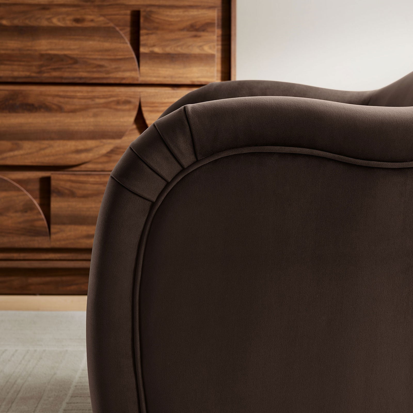 Arm pleats and luxe velvet texture shown in a warm, contemporary room setting. || EEI-7074-CHB || detail_room