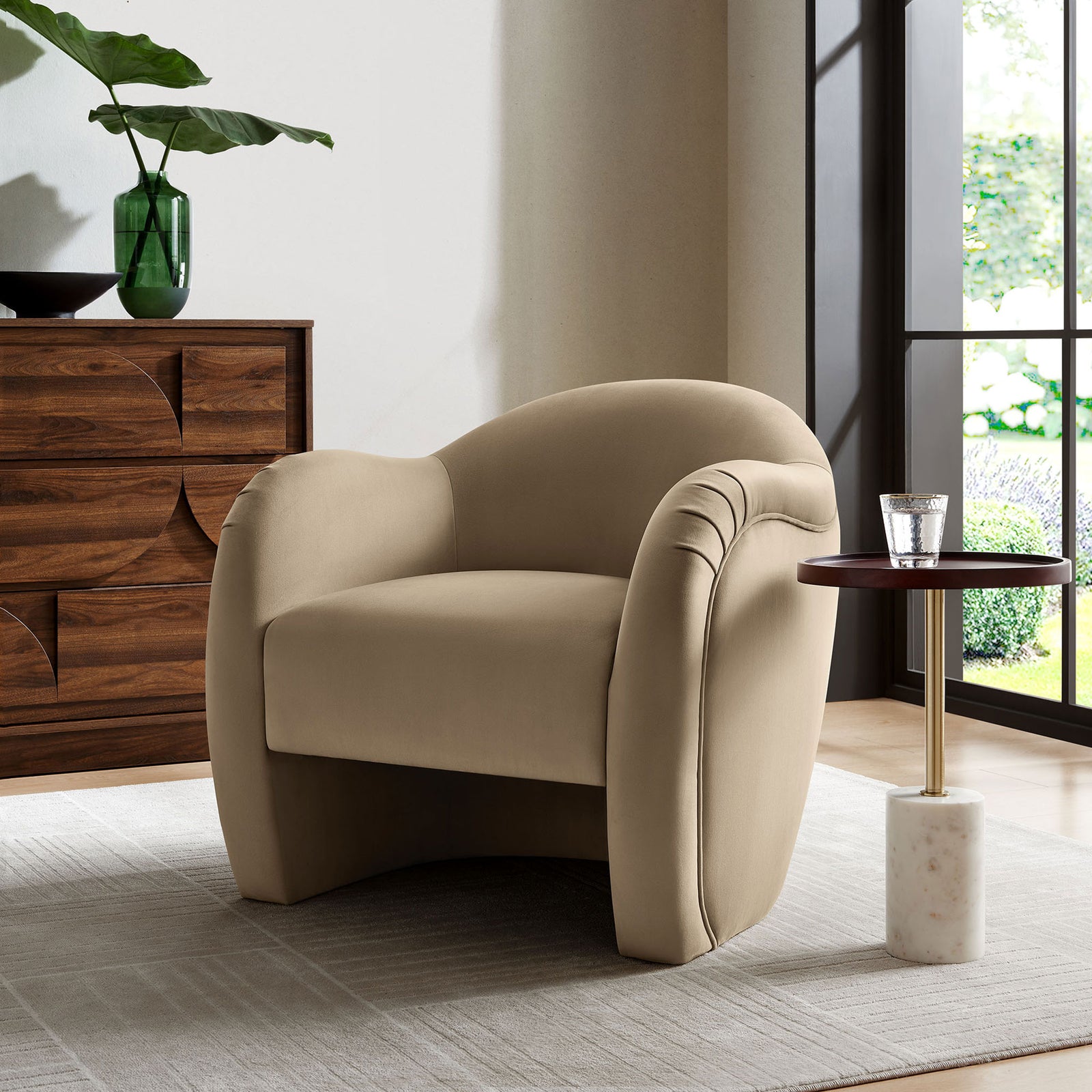 Modern barrel chair in taupe performance velvet brings sculpted curves and cozy comfort to living spaces || EEI-7074-TAU || front_angle_room